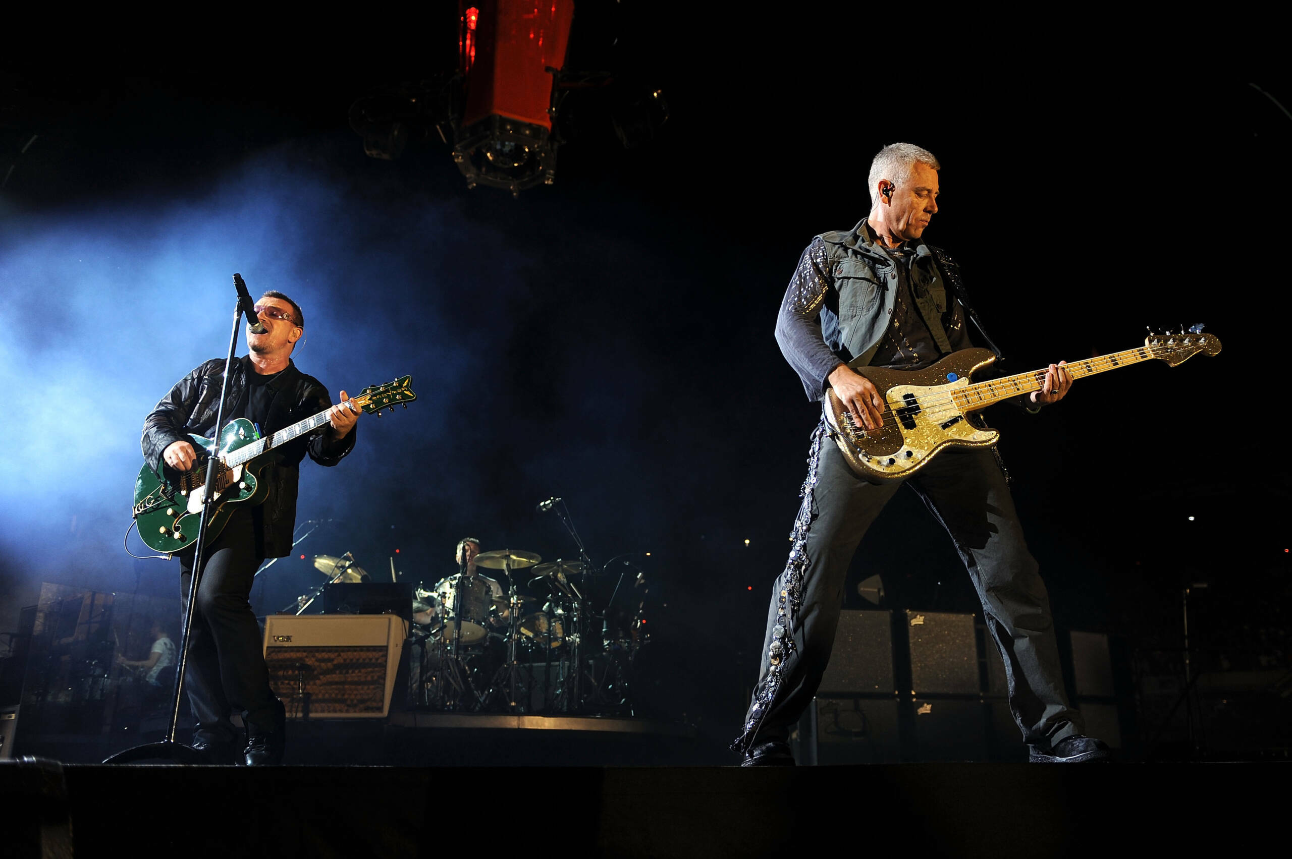 (L-R) Lead singer Bono and bassist Adam Clayton of U2 perform during the U2360 Tour at Soldier Field on September 12, 2009...