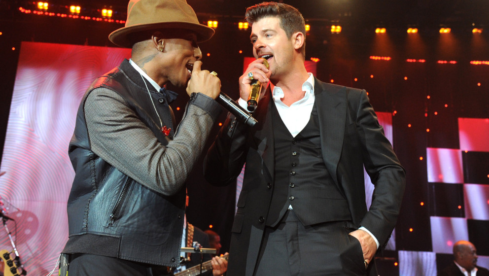 LOS ANGELES, CA - JANUARY 25:  Pharrell Williams and Robin Thicke perform onstage during the 56th annual GRAMMY Awards  Pre-G