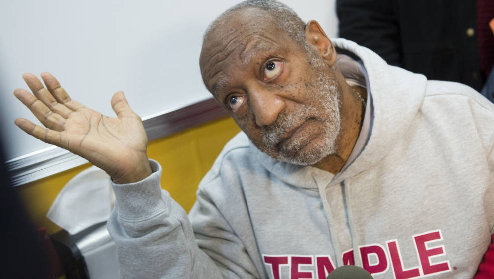 Image #: 27870838    Actor Bill Cosby talks to reporters at the grand opening of Ben's Chili Bowl on March 6, 2014, in Arling