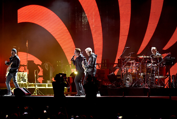 SAN FRANCISCO, CA - OCTOBER 05:  (L-R) The Edge, Bono, Adam Clayton, and Larry Mullen Jr. of U2 perform during the UCSF Benio