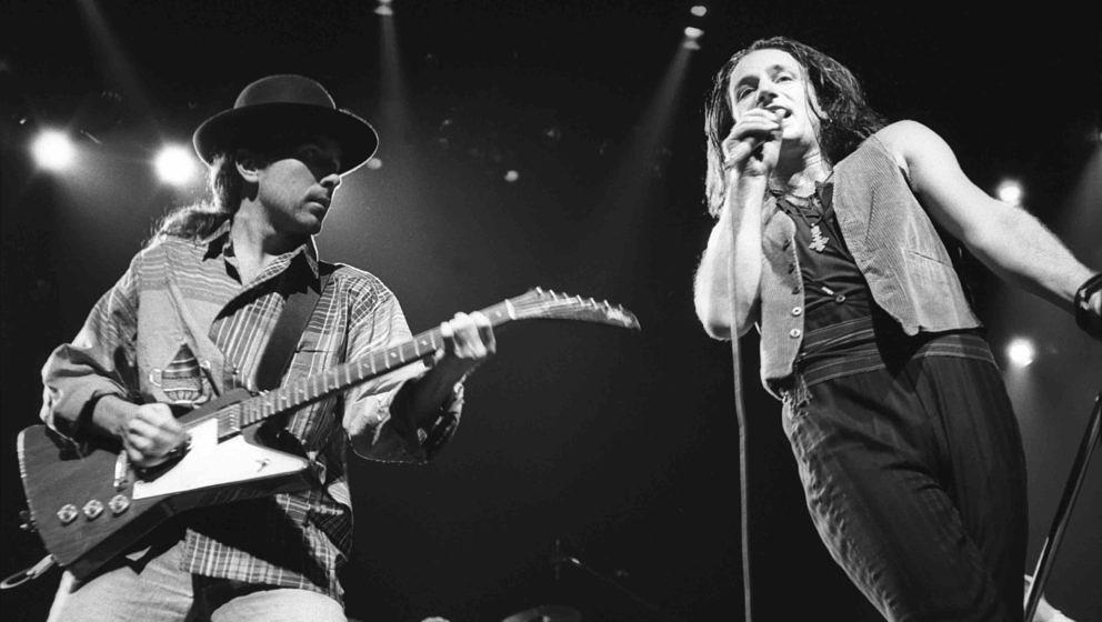 UNIONDALE, NY OCTOBER 9,1987: The Edge and Bono of U2 perform on the Joshua Tree Tour at Nassau Coliseum on October 9, 1987 i