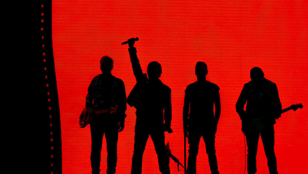 LONDON, ENGLAND - JULY 08:  Adam Clayton (L), Bono, Larry Mullen Jr. and The Edge of U2 performing at Twickenham Stadium on J