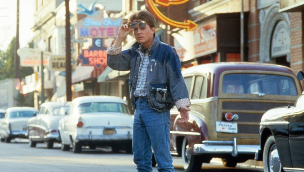 Michael J Fox walking across the street in a scene from the film 'Back To The Future', 1985. (Photo by Universal/Getty Images