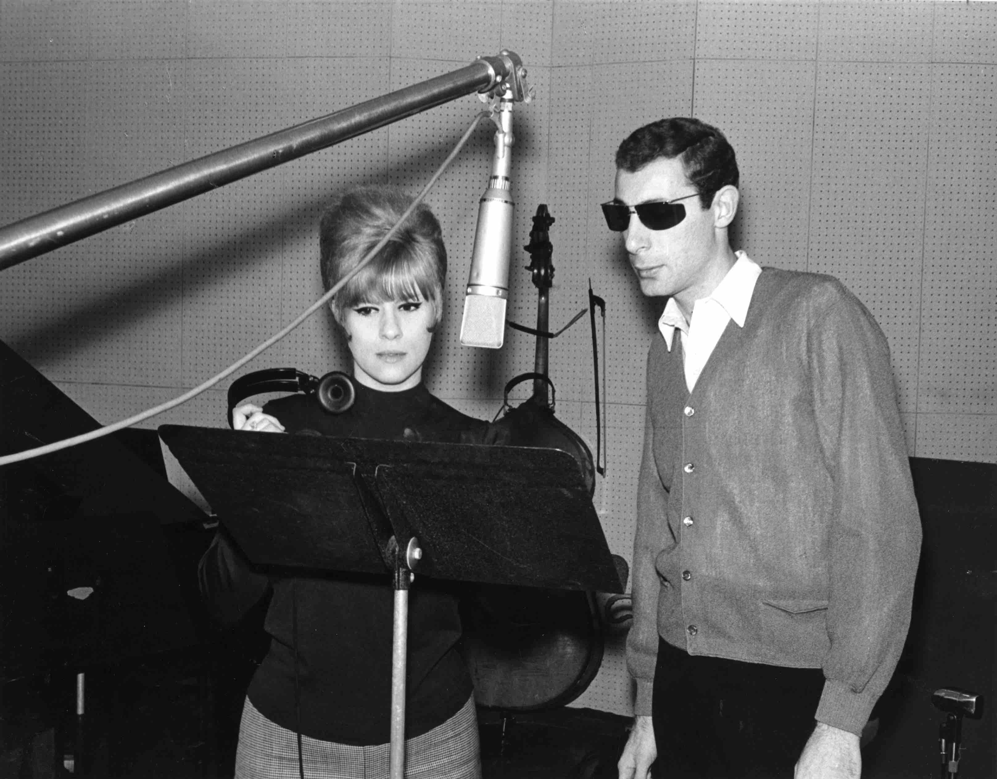 NEW YORK - 1964: Songwriters and producers Jeff Barry and Ellie Greenwich record a demo in the studio in 1964 in New York ...