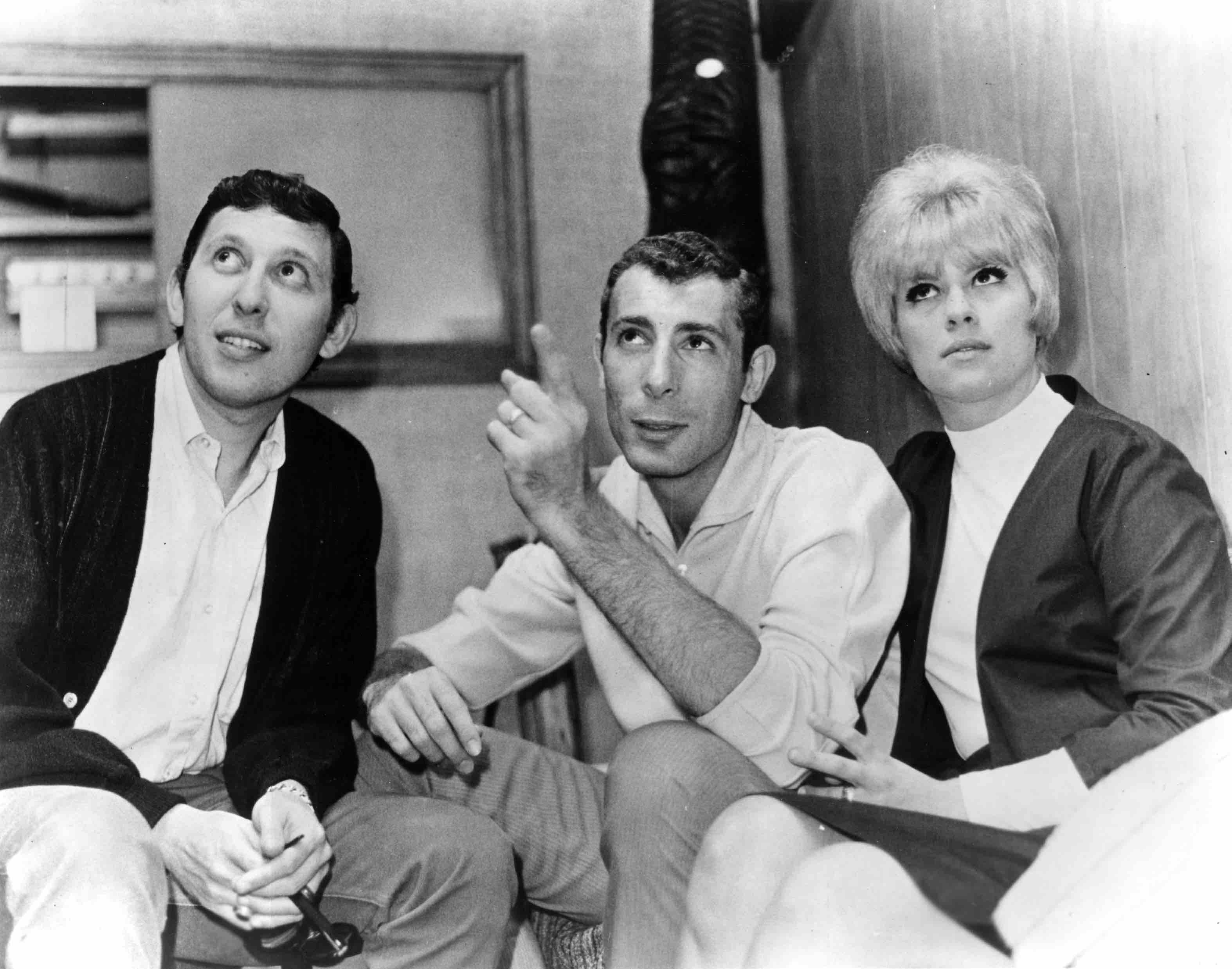 NEW YORK - CIRCA 1965:  Music producer Brooks Arthur (left) chats with songwriters and producers Jeff Barry and Ellie Gree...