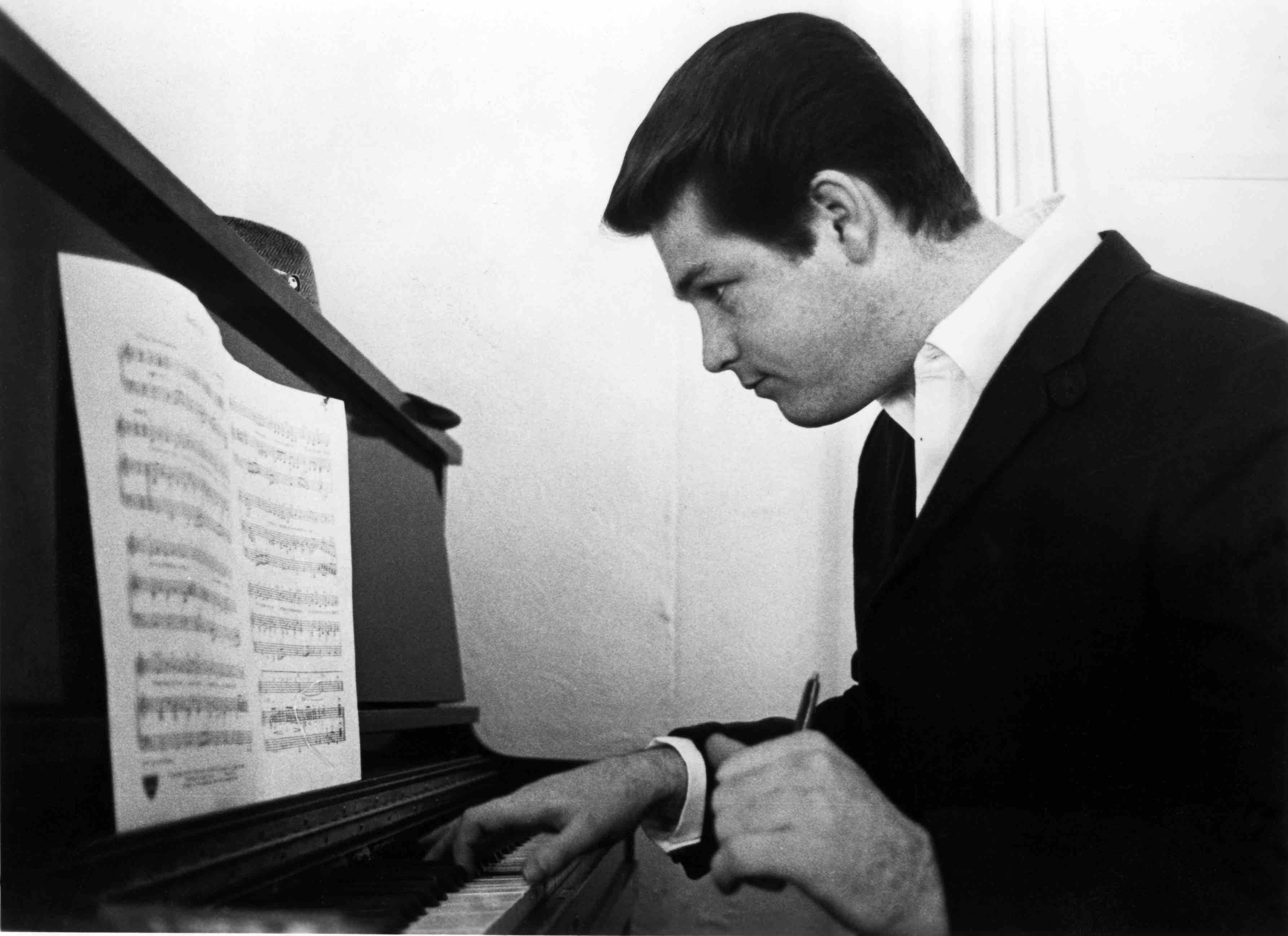 LOS ANGELES - 1964:  Musician Brian Wilson of the rock and roll band "The Beach Boys" works on a composition on an upright...