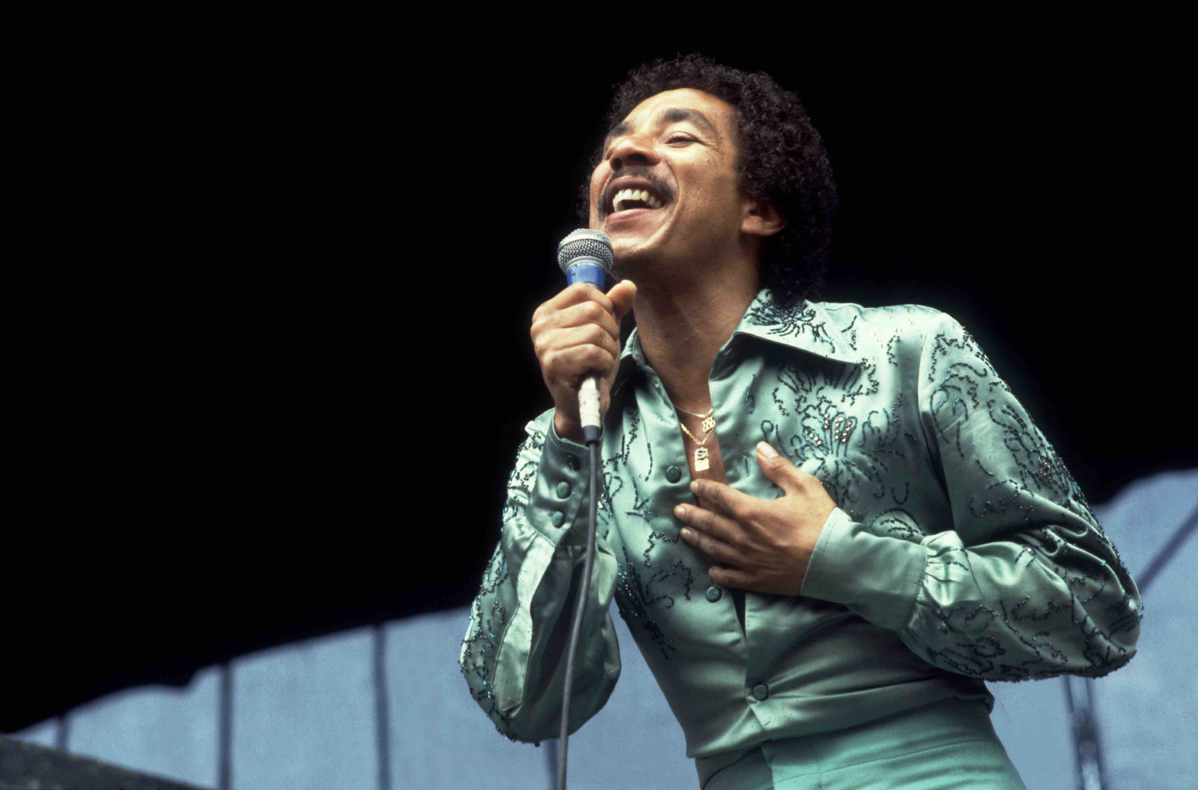 American singer Smokey Robinson performs onstage at Soldier Field, Chicago, Illinois, July 18, 1980. (Photo by Paul Natkin...