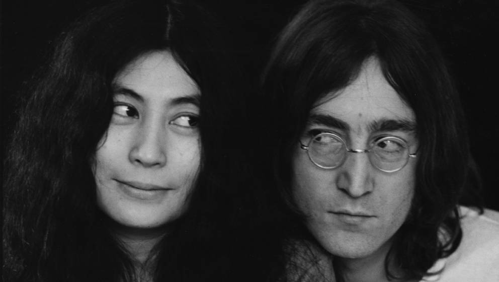Close-up portrait of Japanese-born artist and musician Yoko Ono and British musican and artist John Lennon (1940 - 1980), Dec