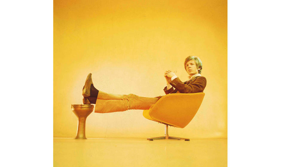 UNSPECIFIED - JANUARY 01:  Photo of Scott WALKER; Scott Walker (Scott Engel) posed, studio, sitting on 1960s chair, solo era 