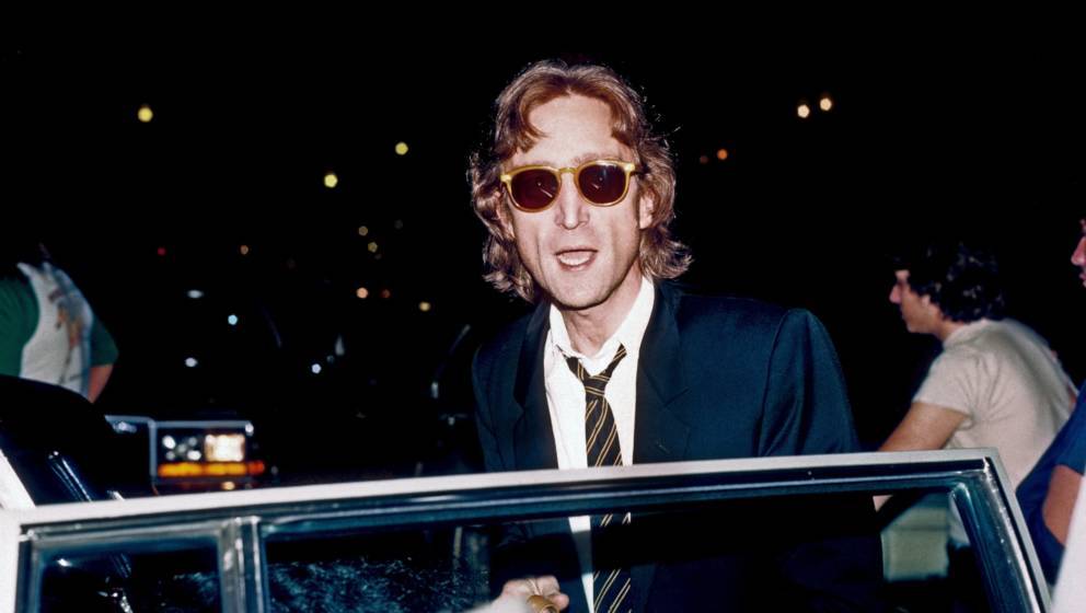NEW YORK - AUGUST 1980: Former Beatle John Lennon arrives at the Times Square recording studio 'The Hit Factory' before a rec