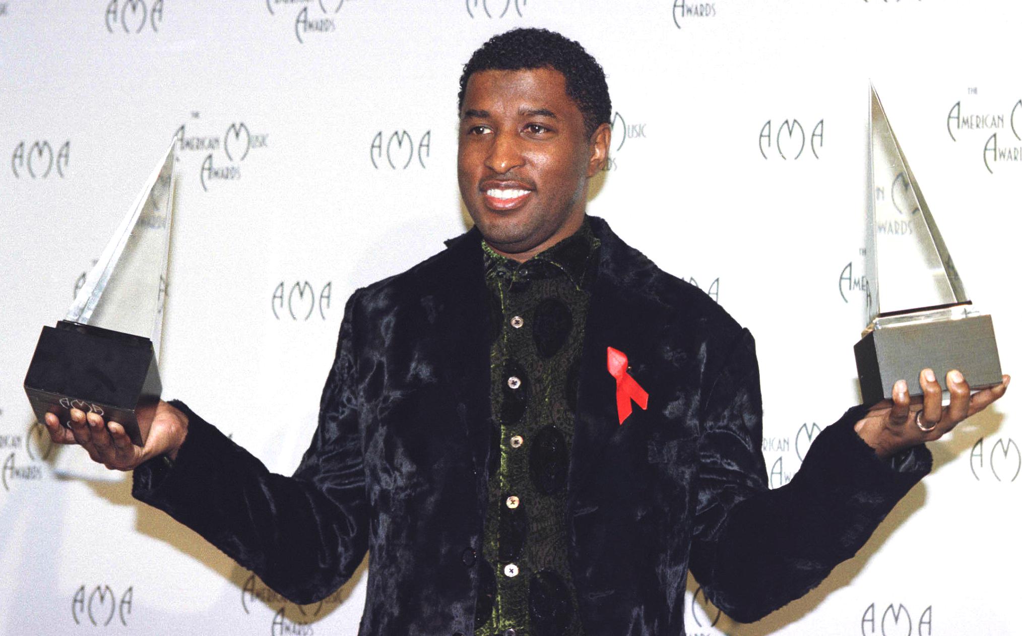 Kenneth "Babyface" Edmonds holds the awards he won for favorite male artist in both the Pop/Rock and Soul/Rhythm and Blues...