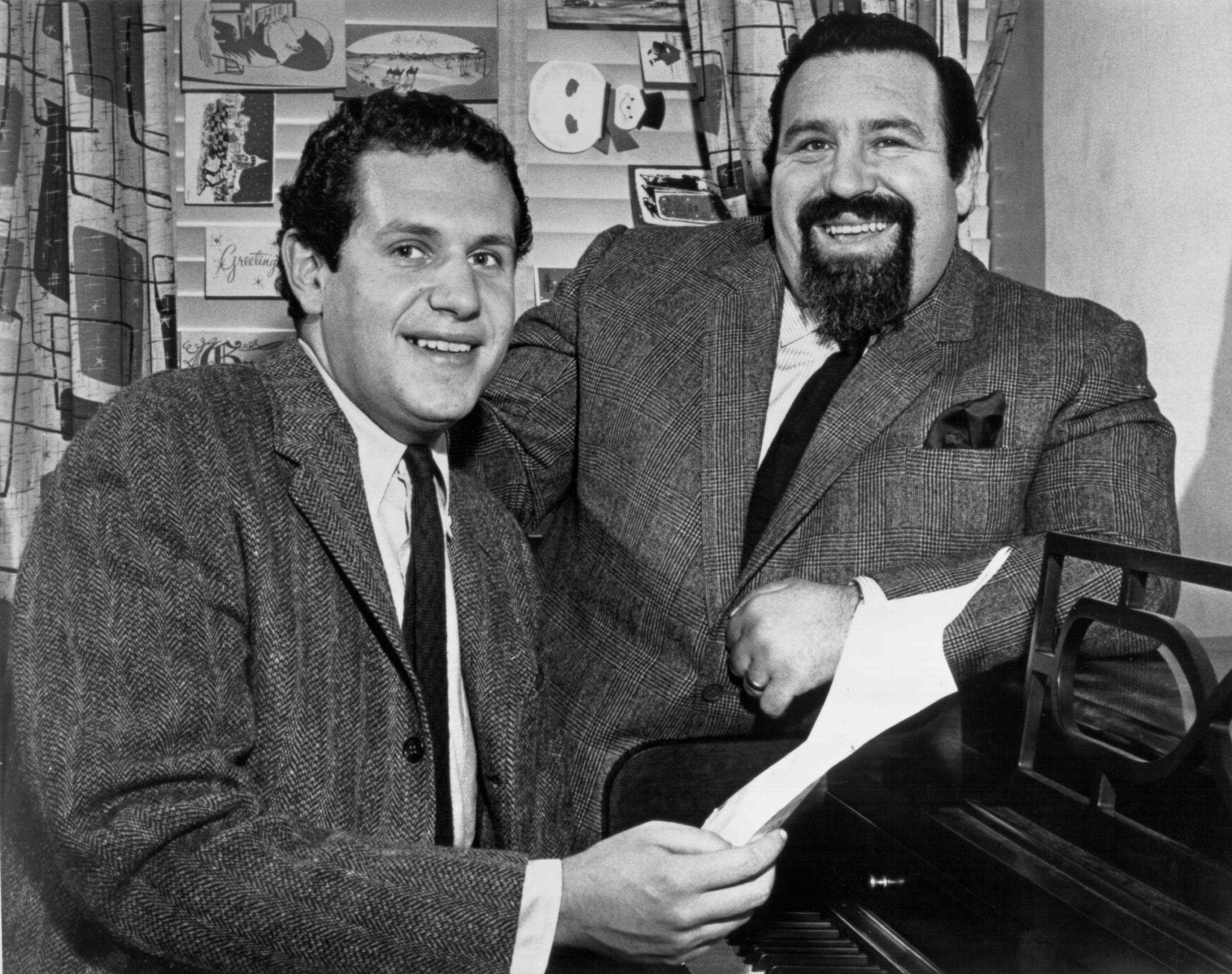 NEW YORK CITY - DECEMBER 1958:  Lyricist Doc Pomus and Pianist Mort Shuman pose for a portrait in their studio in the Bril...