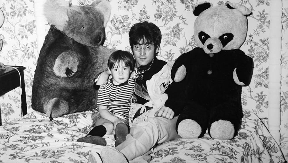 WEYBRIDGE, UNITED KINGDOM - CIRCA 1960: John Lennon and his son Julian relaxing at home in Weybridge, United Kingdom, circa 1