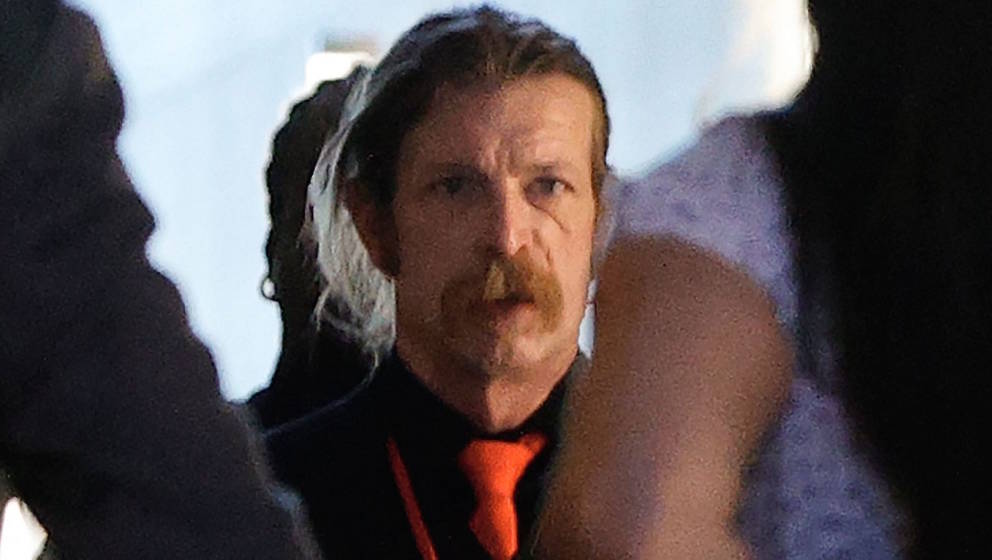 US singer Jesse Hughes, member of the Eagles of Death Metal (C) arrives to be heard in the November 13, 2015 Paris trial at a