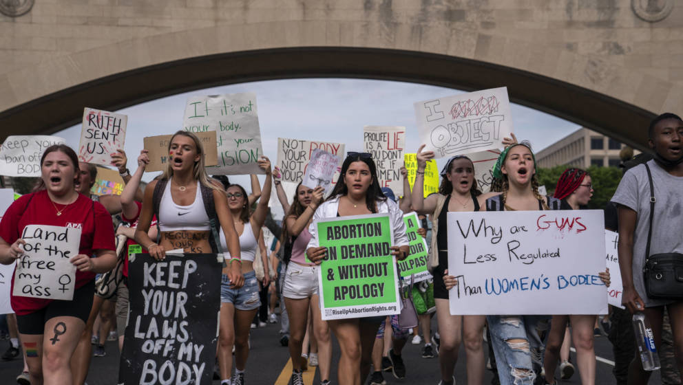 WASHINGTON, DC - JUNE 26: Abortion-rights activists march toward the White House on June 26, 2022 in Washington, DC. The Supr