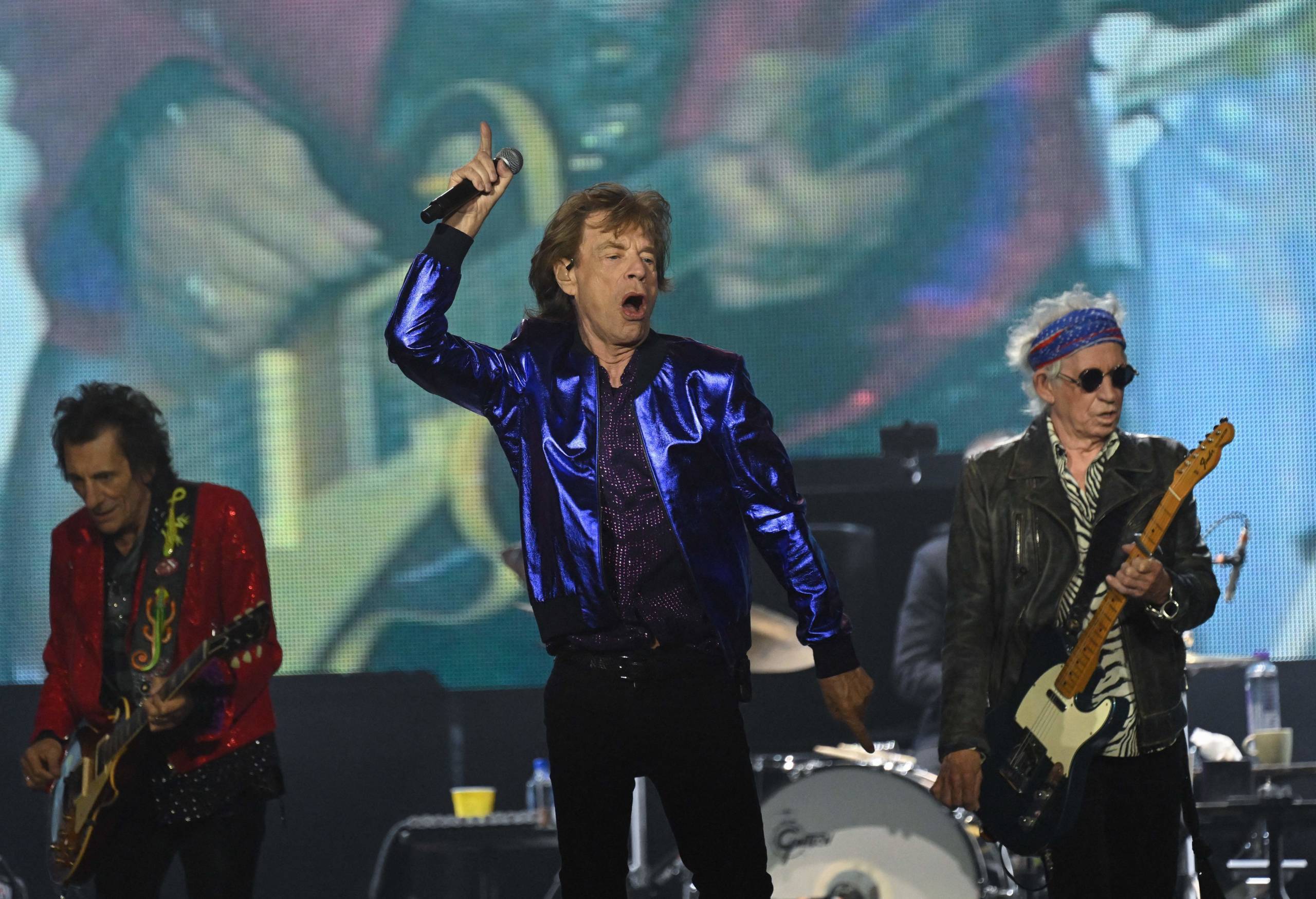 British rock band The Rolling Stones' singer Mick Jagger (C) , guitarists Keith Richards (R) and Ron Wood perform during a...