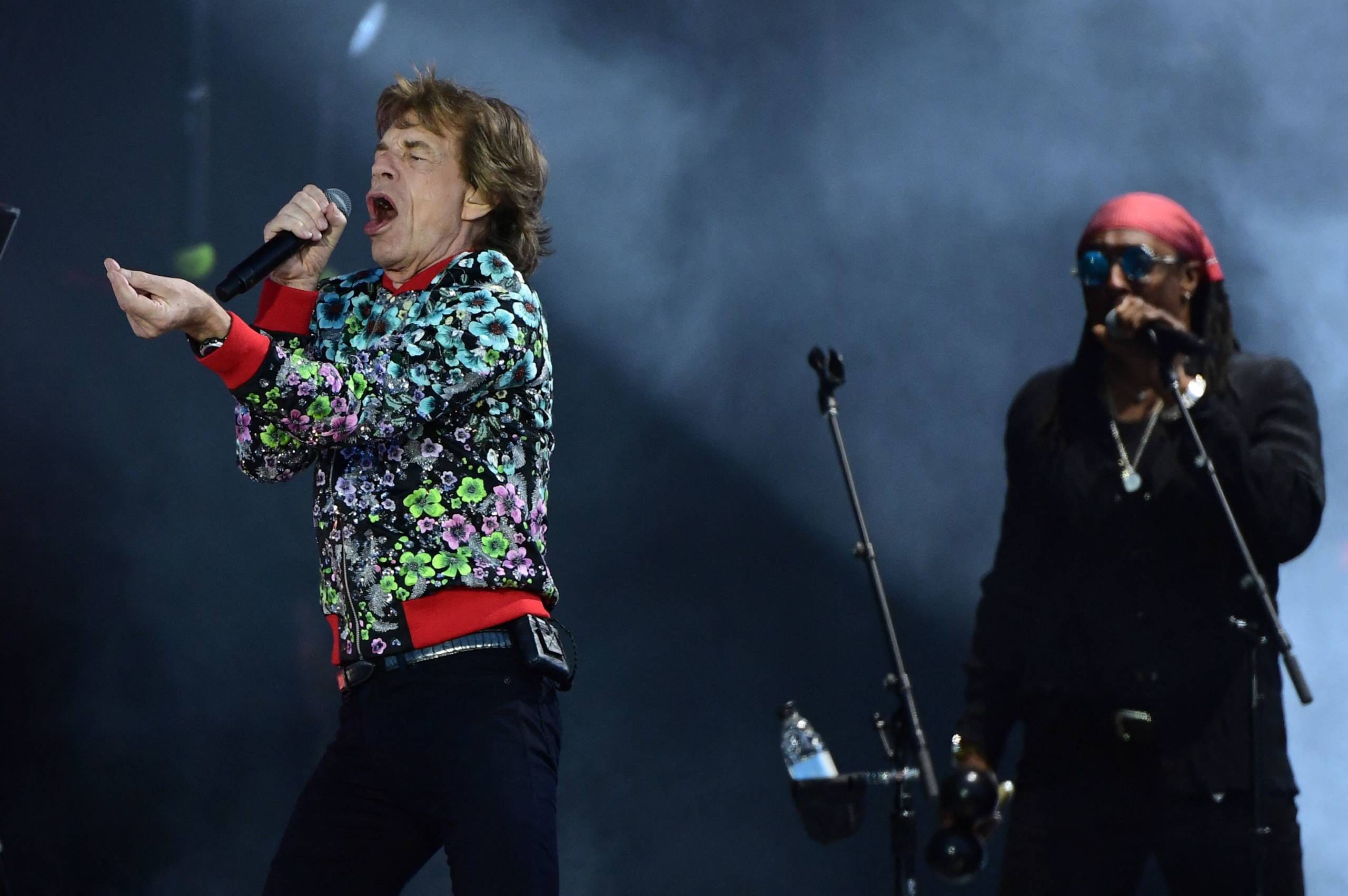 British rock band The Rolling Stones' singer Mick Jagger (L) performs during a concert as part of their 'Stones Sixty Euro...