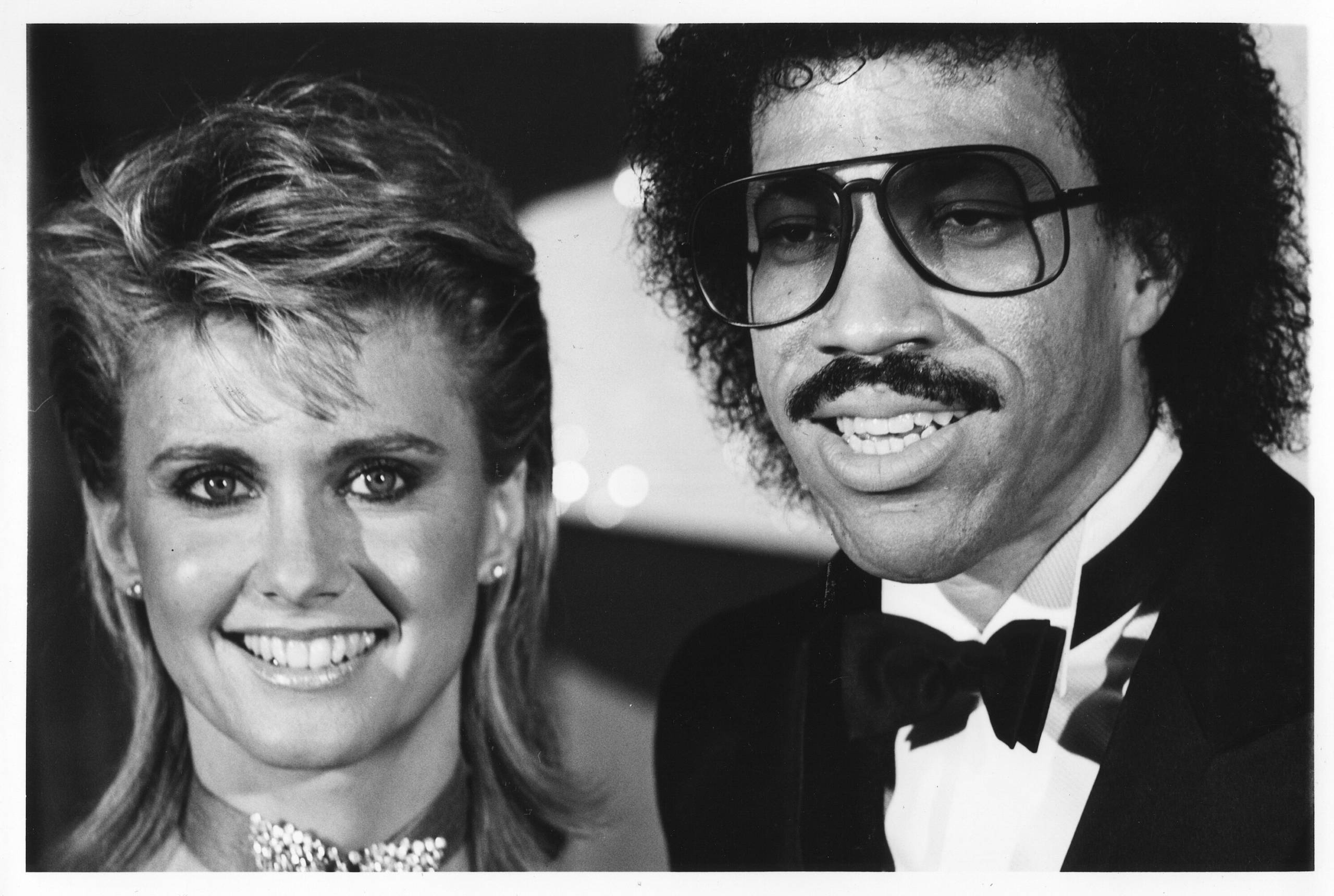 Lionel Richie and Olivia Newton-John attend the Grammy Awards at the Shrine Auditorium at 1983 in Los Angeles. (Photo by S...
