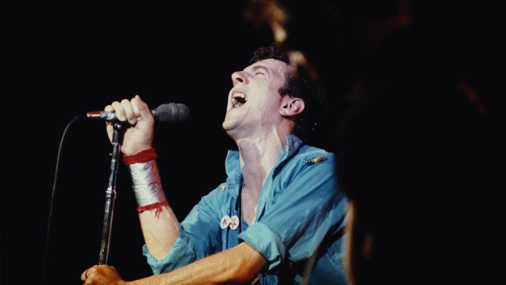 Singer Joe Strummer (1952 - 2002), of British punk group The Clash, performing in New York, September 1979.  (Photo by Michae