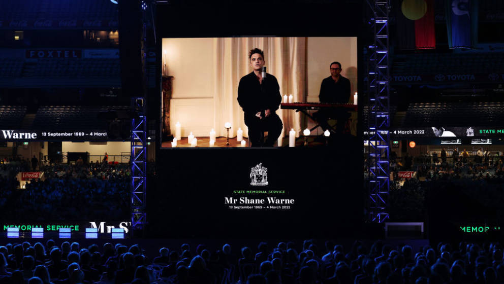 MELBOURNE, AUSTRALIA - MARCH 30: Robbie Williams is seen in the big screen during the state memorial service for former Austr