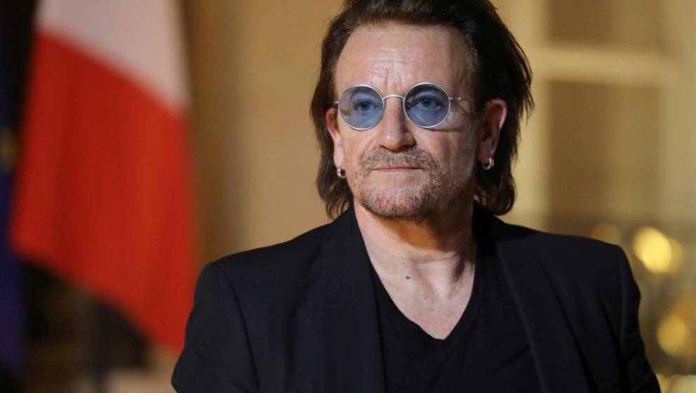 Irish lead singer of rock band U2, Paul David Hewson aka Bono delivers a statement in the courtyard of the Elysee Palace, in 