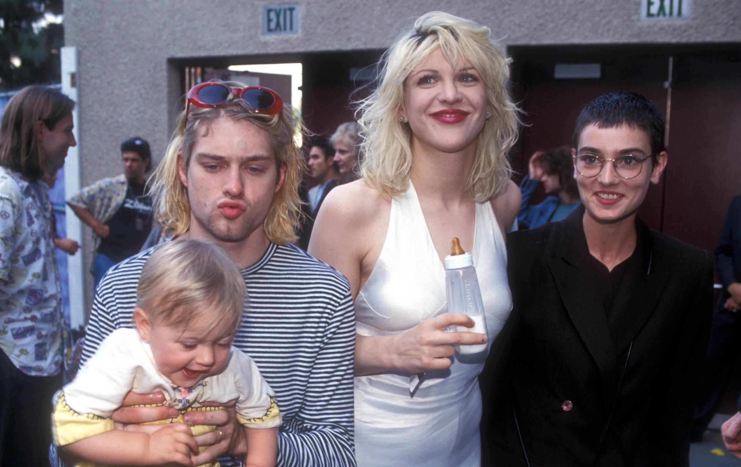Kurt Cobain of Nirvana with wife Courtney Love and daughter Frances Bean Cobain, and Sinead O'Connor (Photo by Kevin Mazur...