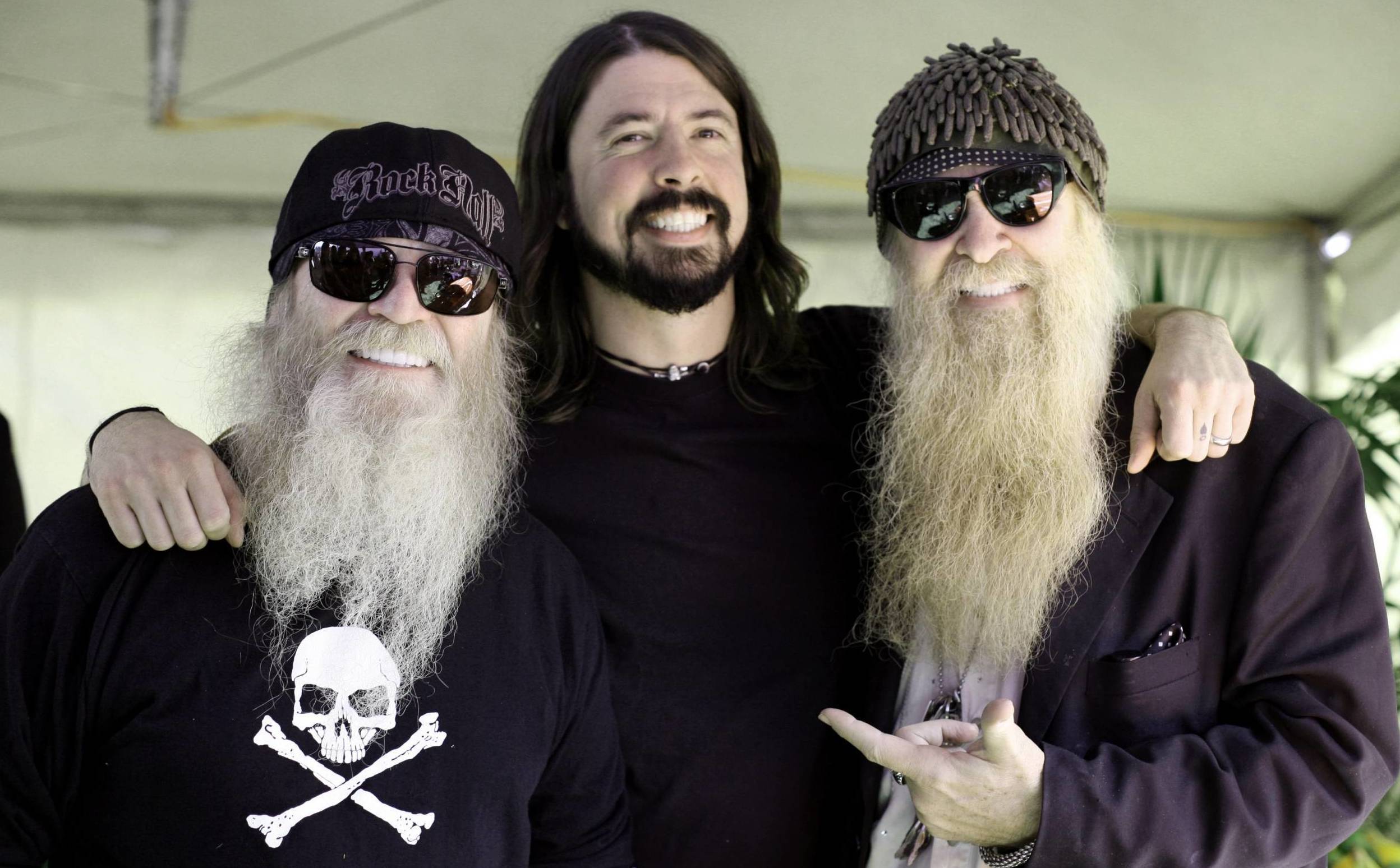 POMONA, CA - OCTOBER 26:  (L-R) Dusty Hill bassist for ZZ Top, Dave Grohl guitarist and singer for The Foo Fighters and Bi...
