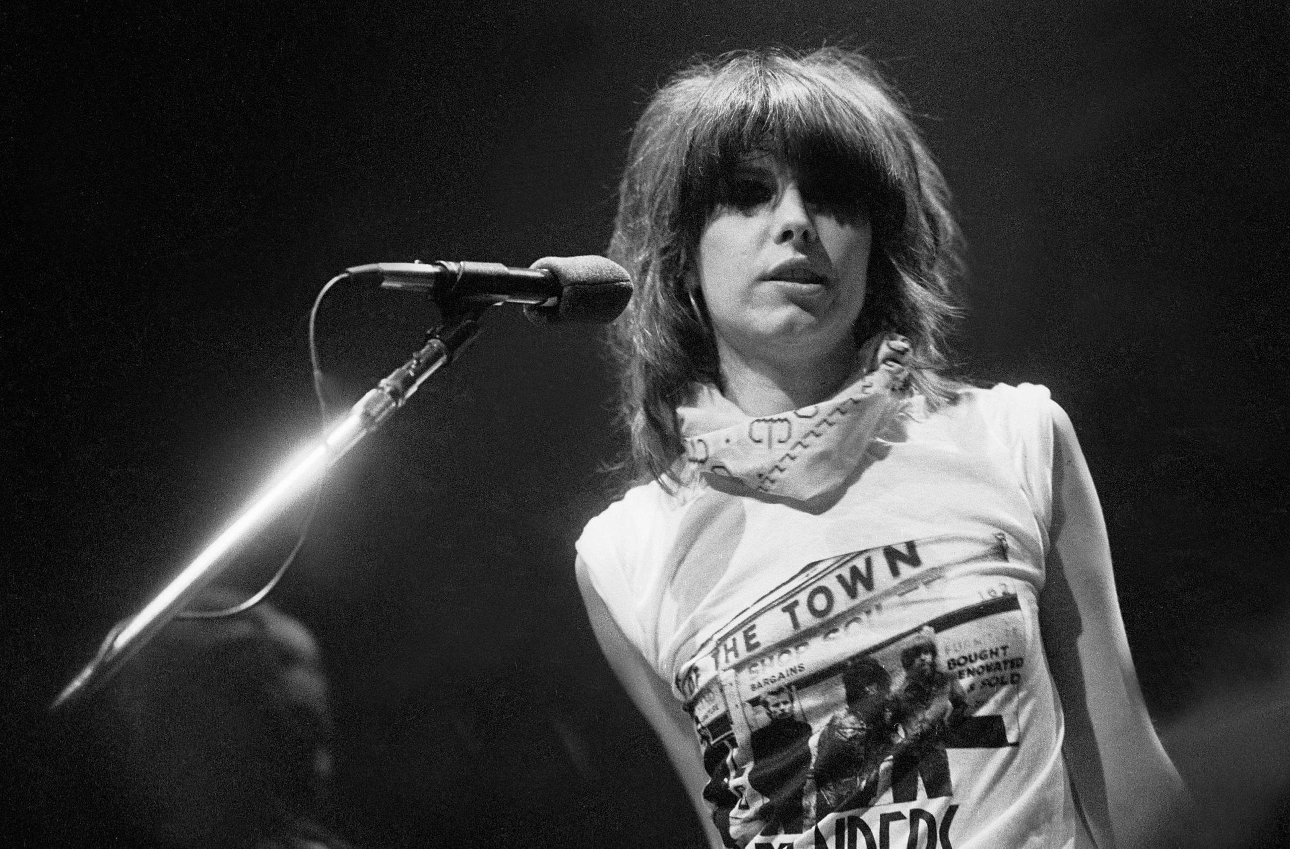 American musician Chrissie Hynde, of the group Pretenders, plays guitar as she performs at the Park West, Chicago, Illinoi...