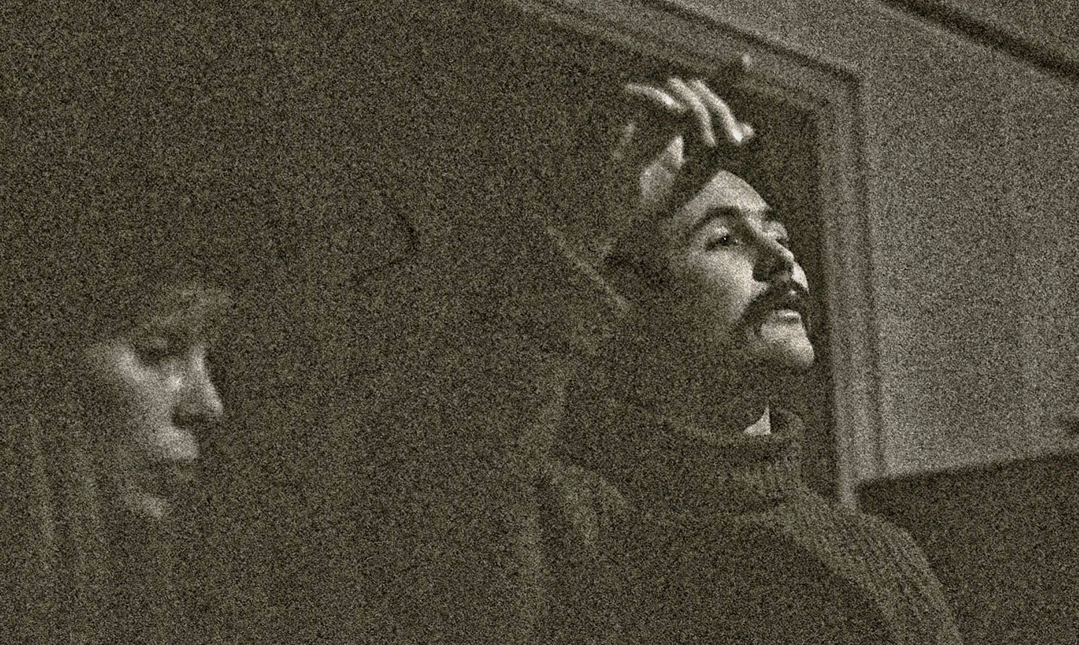 Joni Mitchell listening as David Crosby raises his right hand to gesture, in the control booth. (Photo by Sulfiati Magnuso...