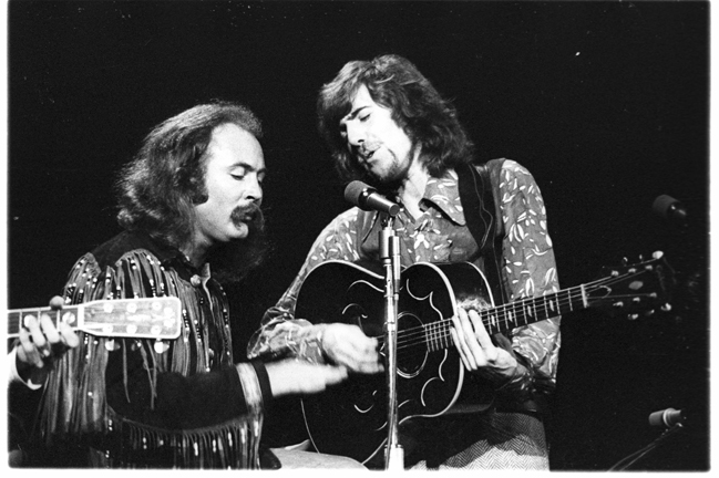 David Crosby and Graham Nash of the group Crosby, Stills, Nash & Young perform at Olympia Stadium on June 12, 1970 in Det