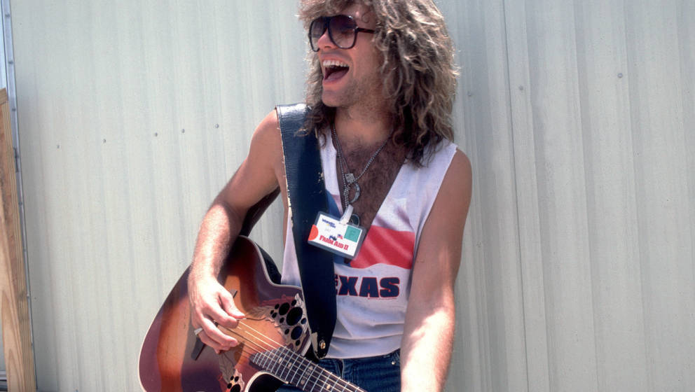 Portrait of American musician Jon Bon Jovi backstage at the Manor Downs Racetrack for the Farm Aid II Concert, Austin, Texas,