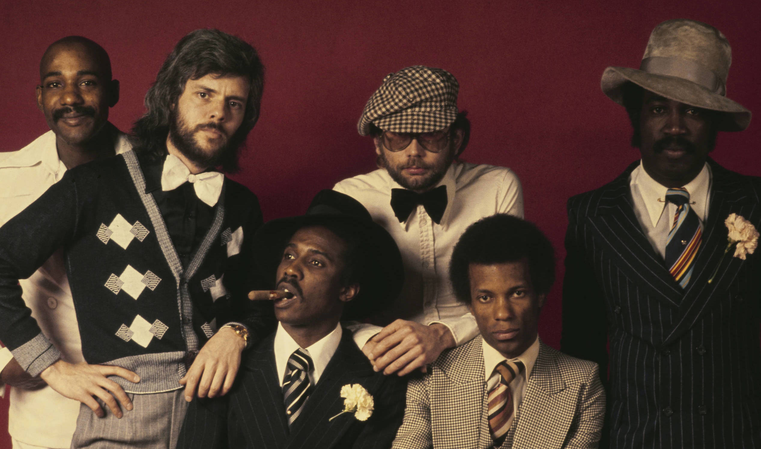 British pop group Hot Chocolate posed together in April 1974. Standing, left to right: singer-songwriter Errol Brown, guit...