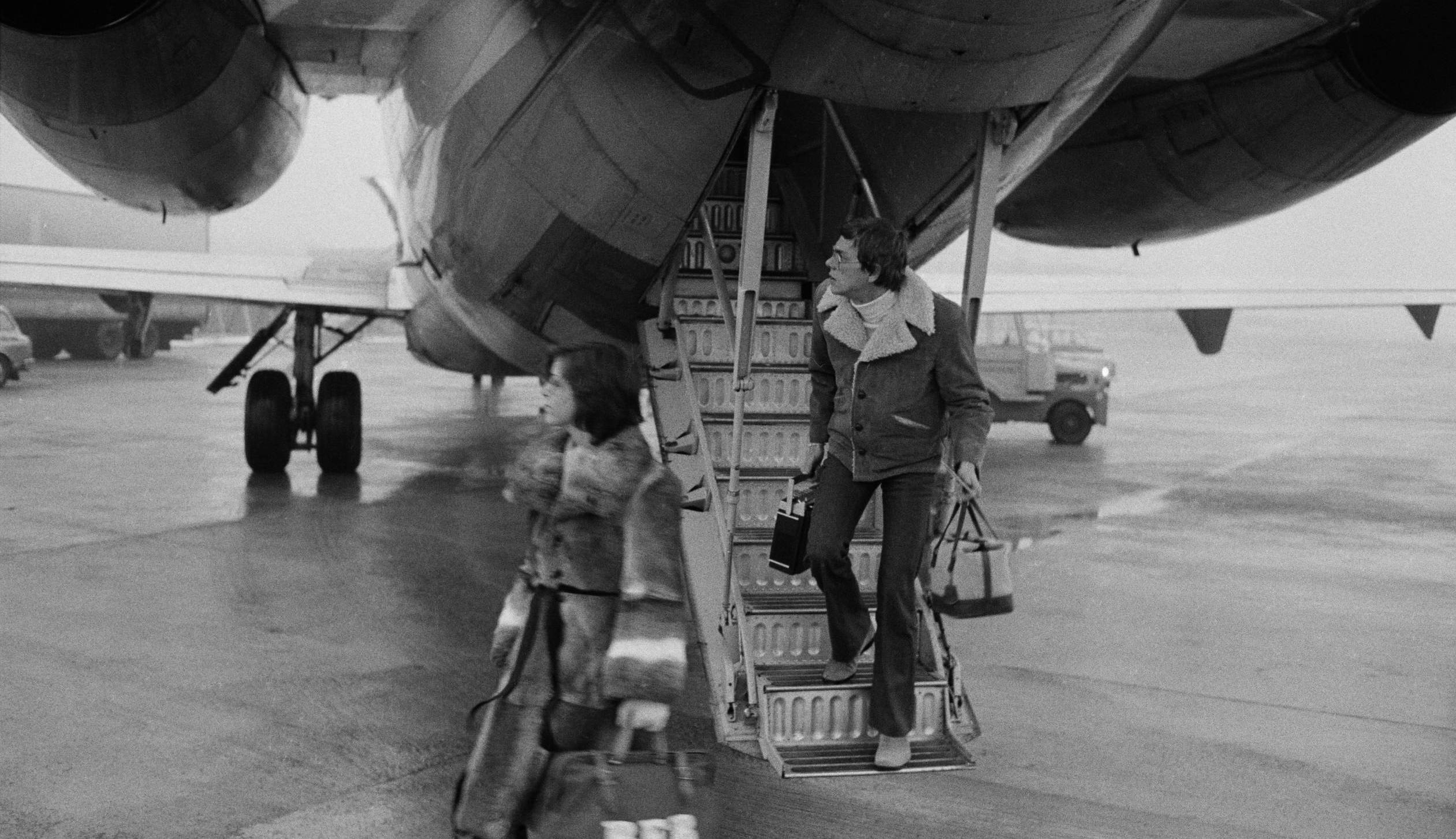 Richard and Karen Carpenter get off a plane on arriving at an airport during a European in 1974. (Photo by Michael Putland...