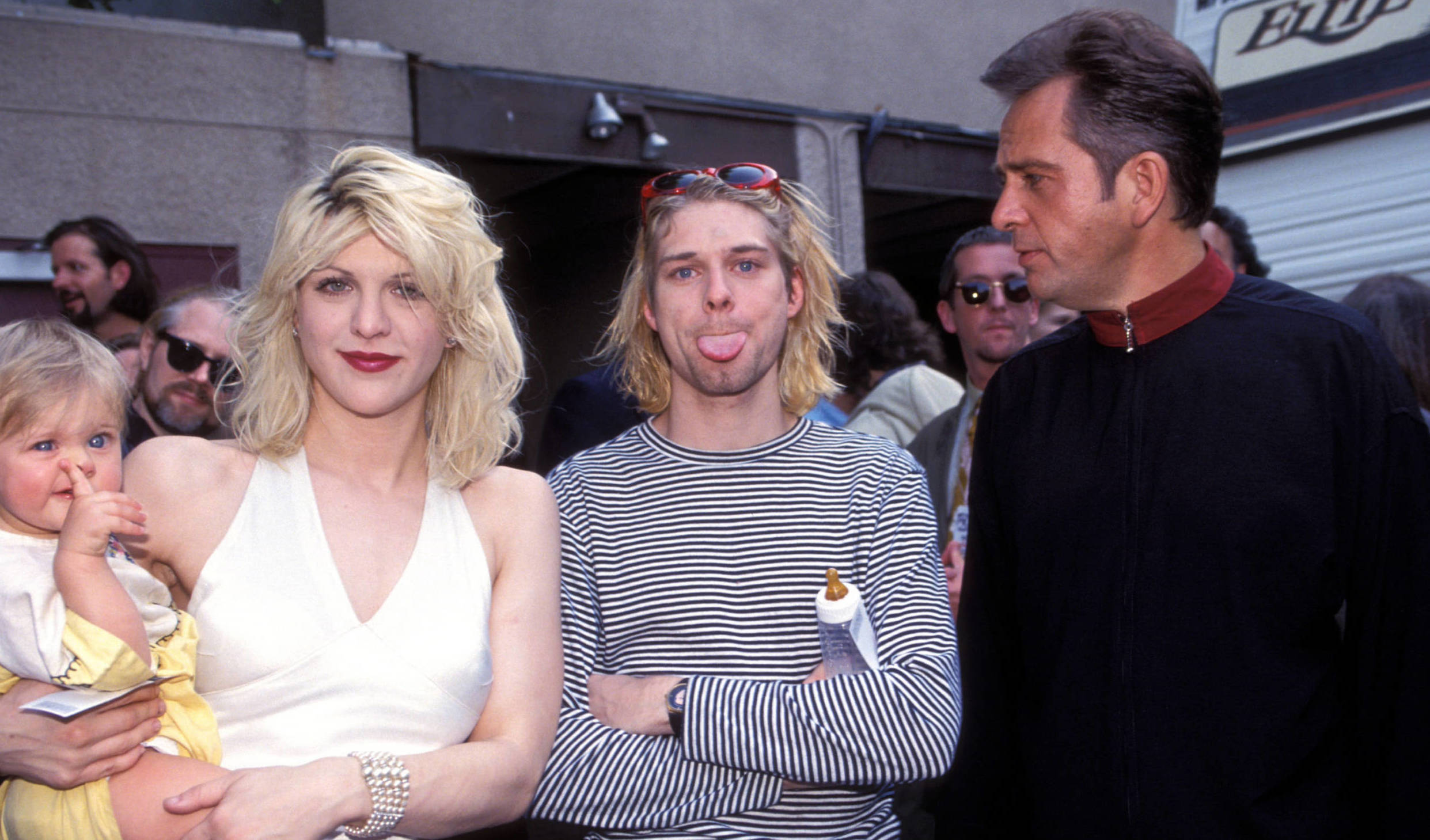Kurt Cobain of Nirvana (center) with wife Courtney Love and daughter Frances Bean Cobain and Peter Gabriel (Photo by Kevin...