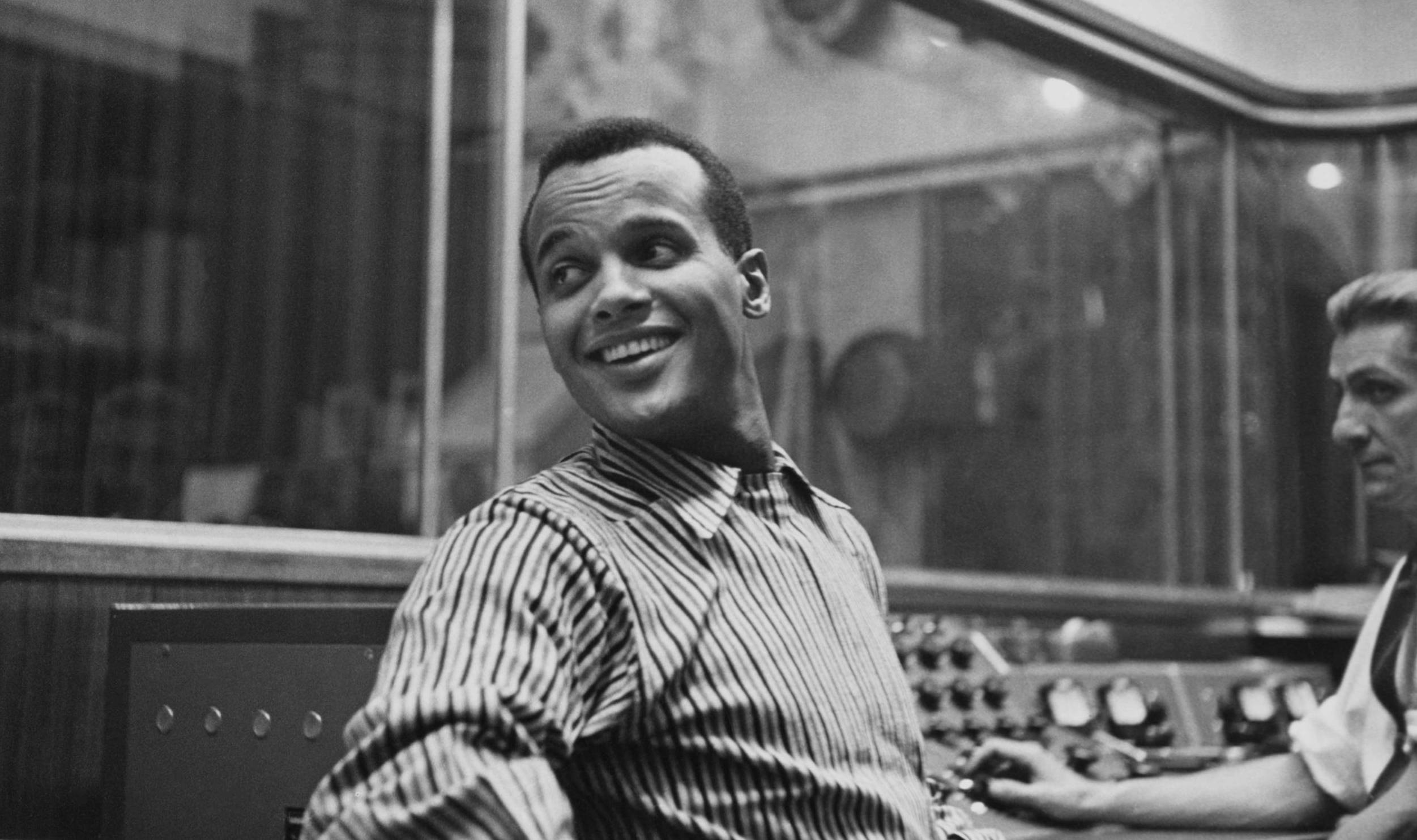 American singer-songwriter and civil rights activist Harry Belafonte, wearing a striped shirt, in an unspecified recording...
