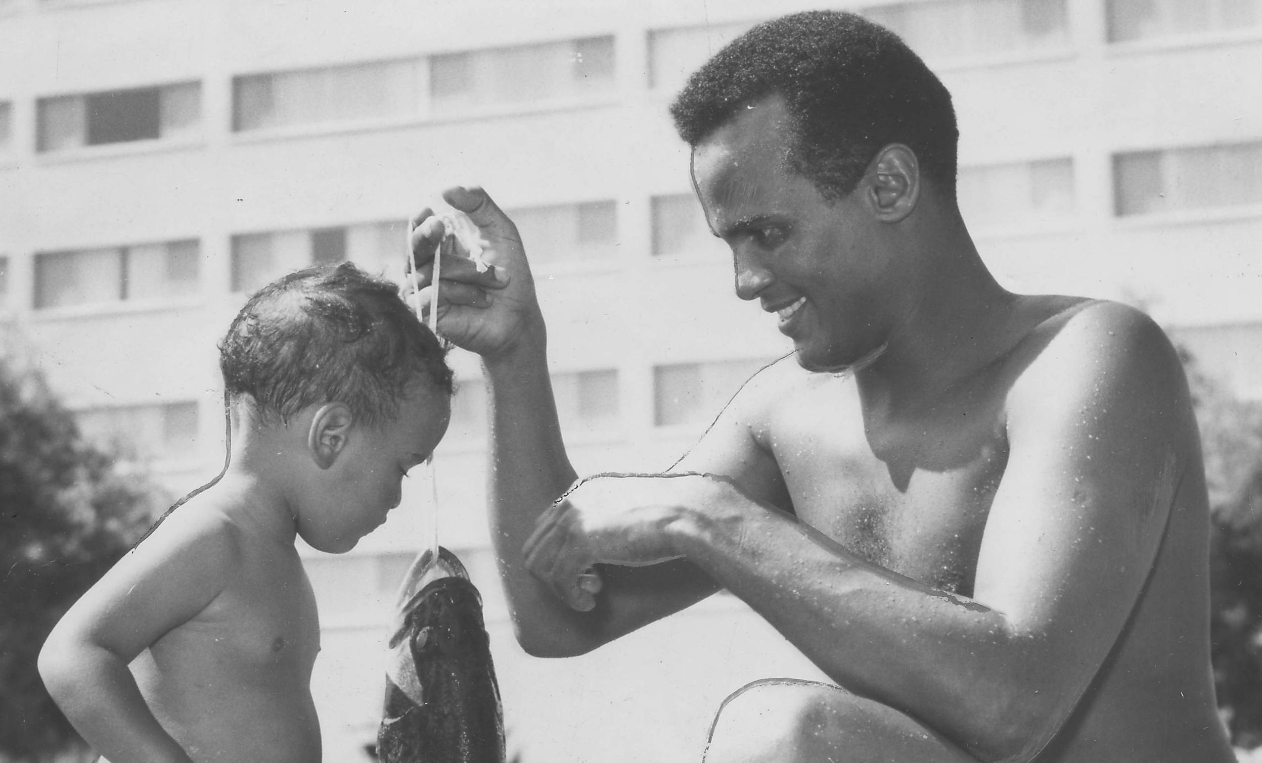 Musician and actor Harry Belafonte and David Belafonte holding a large fish, Lake Mead, Nevada, June 15, 1959. (Photo by A...