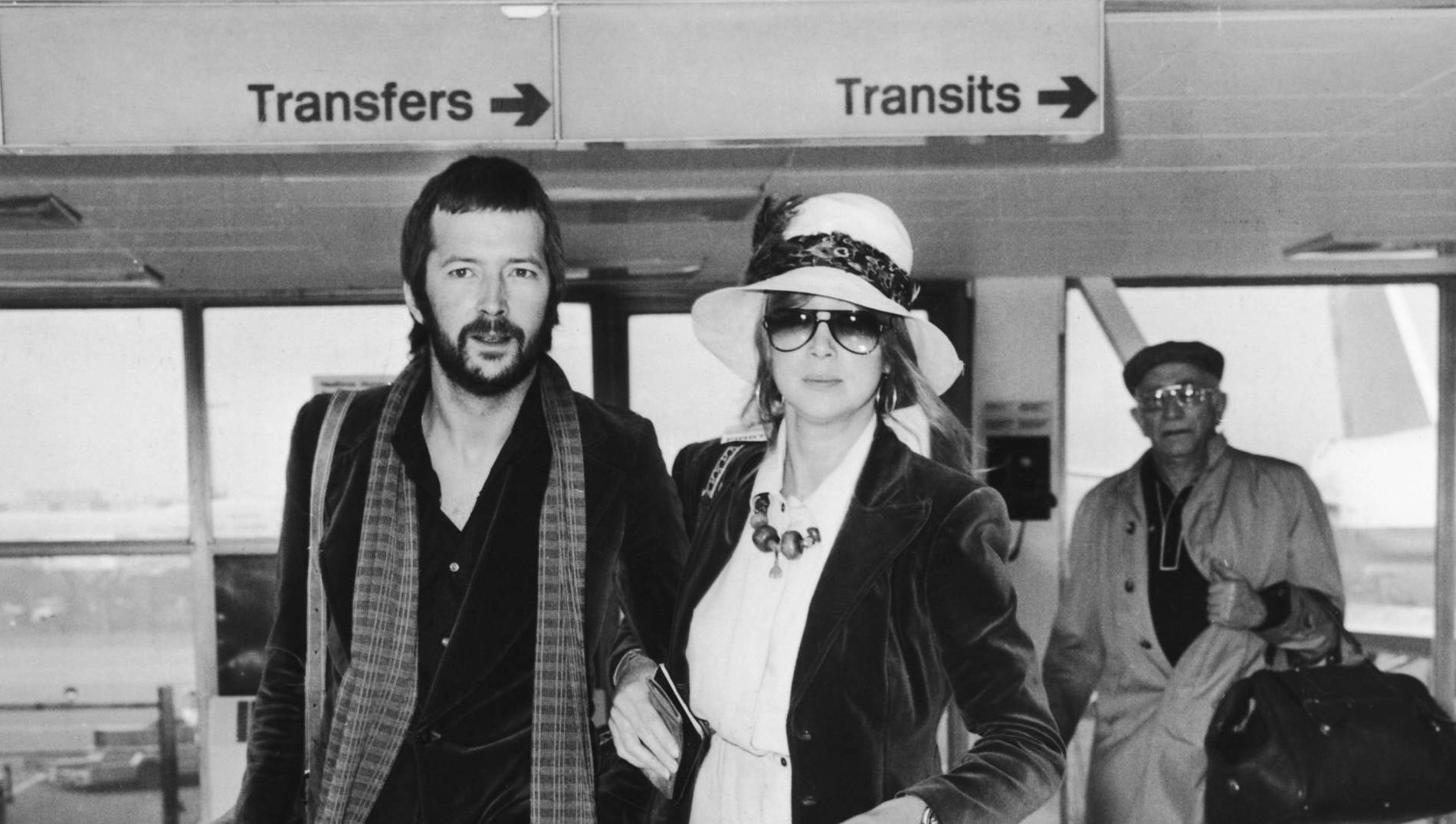 British musician Eric Clapton and his girlfriend Pattie Boyd leave Heathrow for the USA, 28th February 1975. (Photo by Eve...