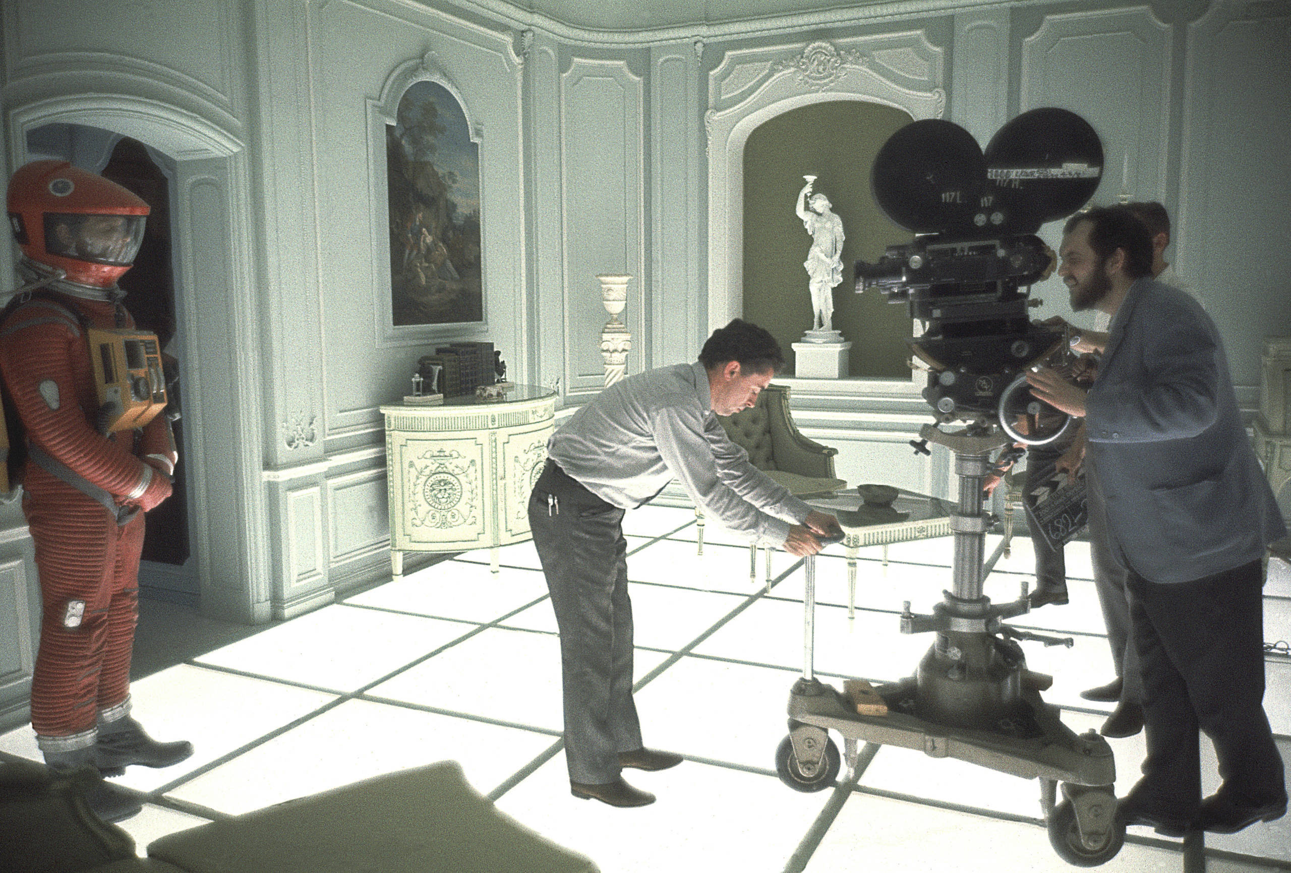 John Alcott adjusts the camera position whilst film director and screenwriter Stanley Kubrick (1928 - 1999) finds his shot...