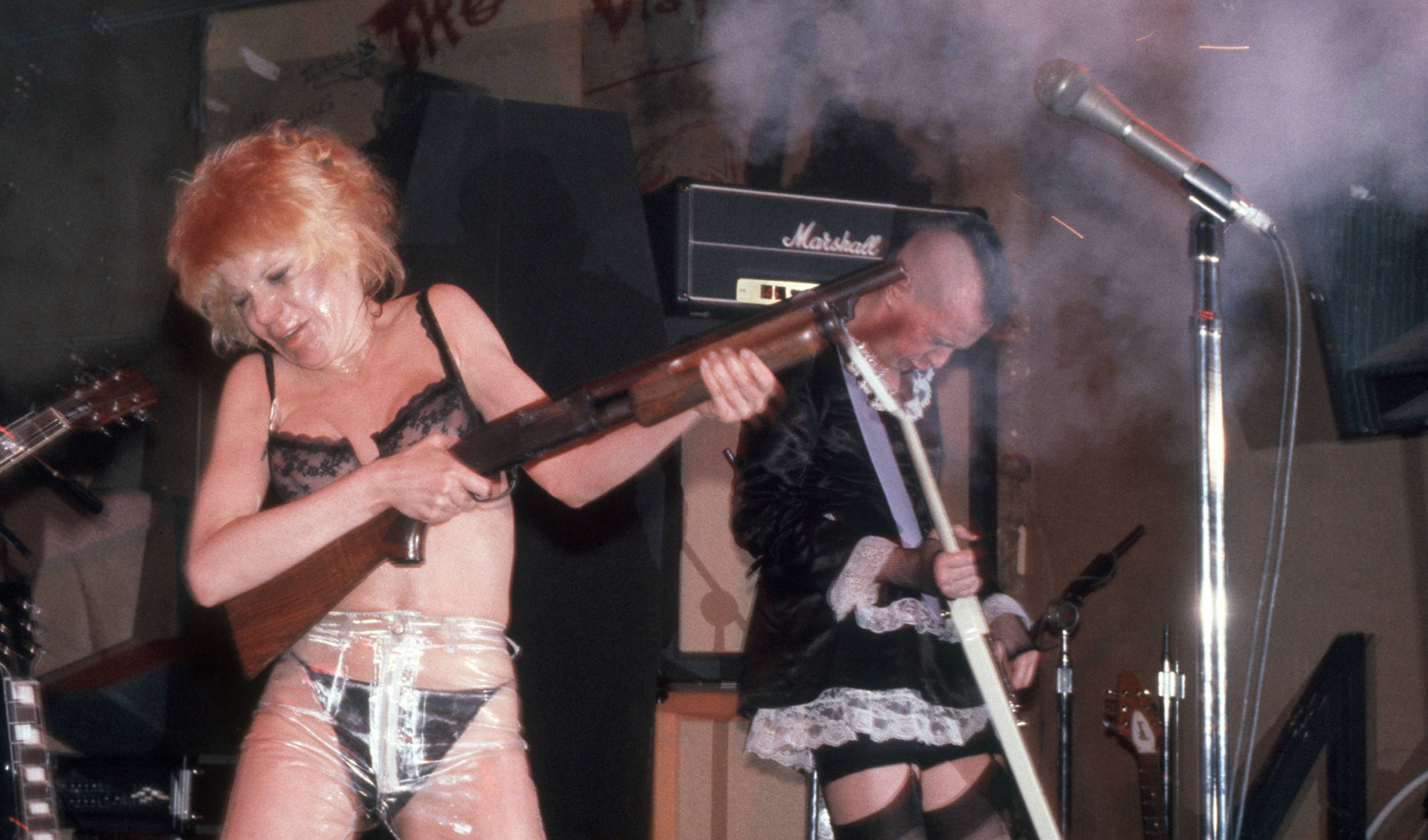 American musician Wendy O Williams, of the group the Plasmatics, fires a shotgun onstage at CBGB, New York, New York, Apri...