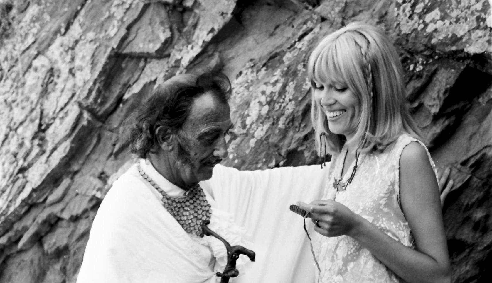The Spanish painter Salvador Dali with his model and muse Amanda Lear during of the filming of the Spanish TV program Do...