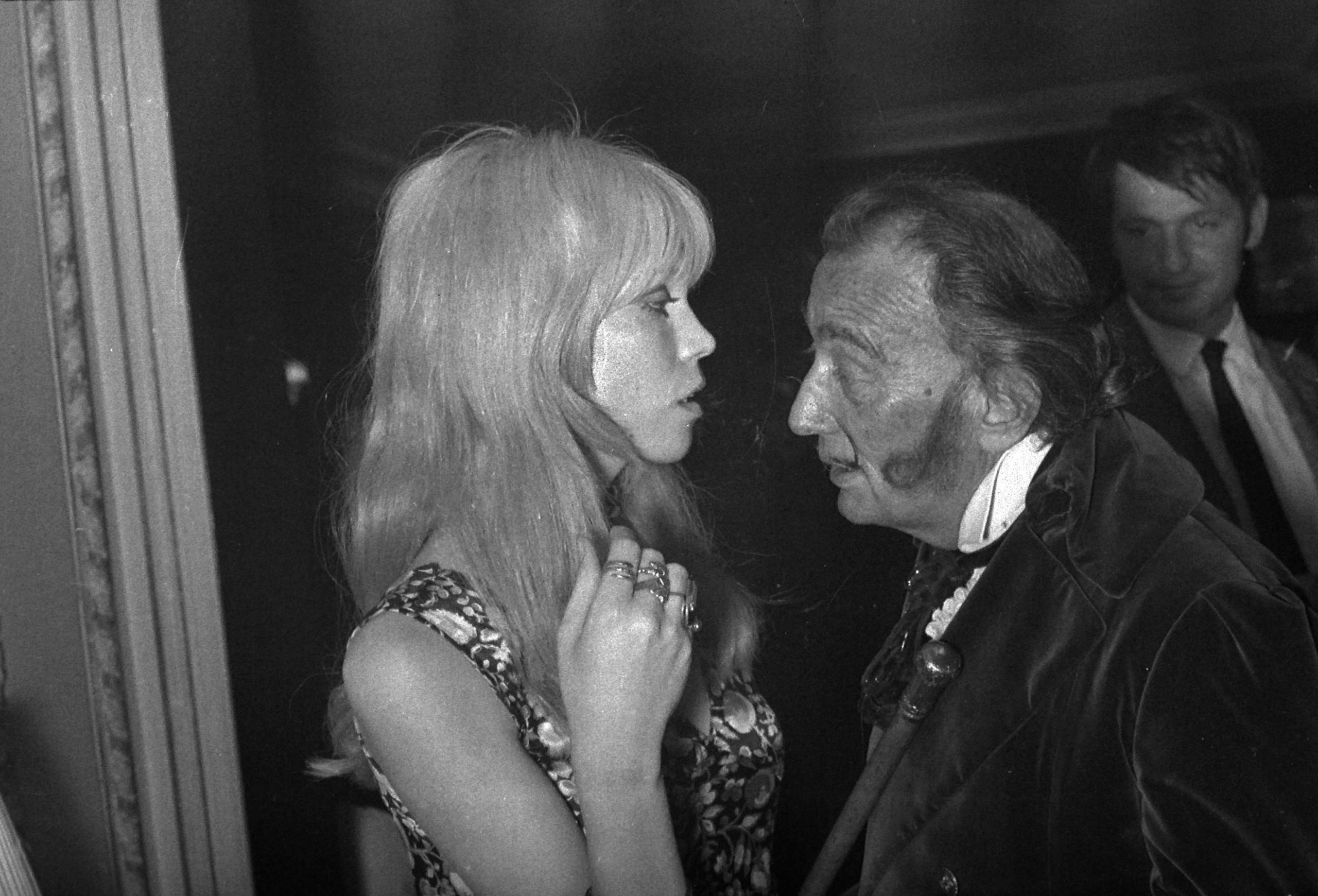 FRANCE - CIRCA 1961:  Salvador Dali (1904-1989), painter and Spanish engraver and Amanda Lear. Paris, years 1960.   HA 101...