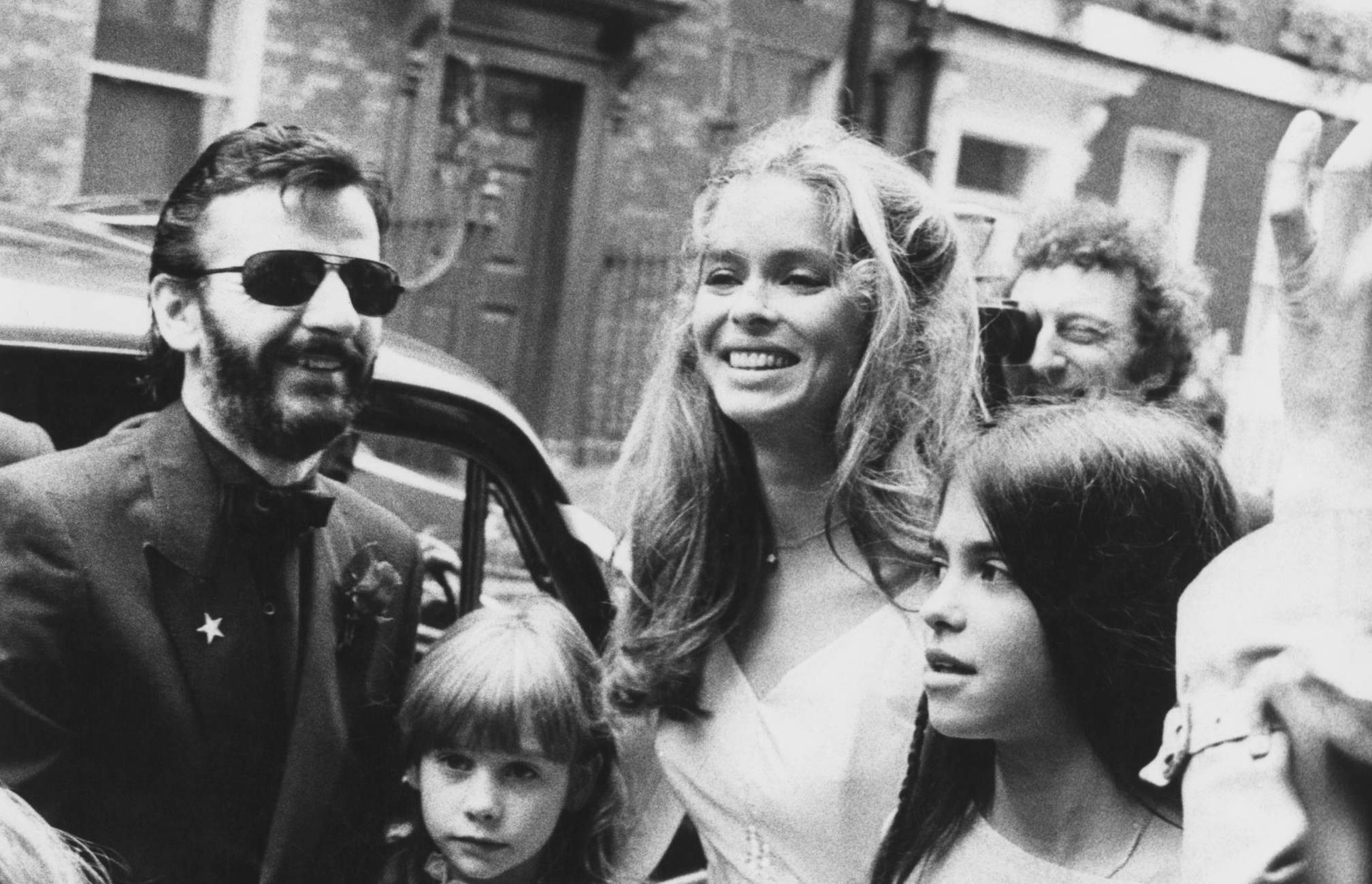 Drummer Ringo Starr, formerly of British rock group the Beatles, and his new bride, actress Barbara Bach after their weddi...
