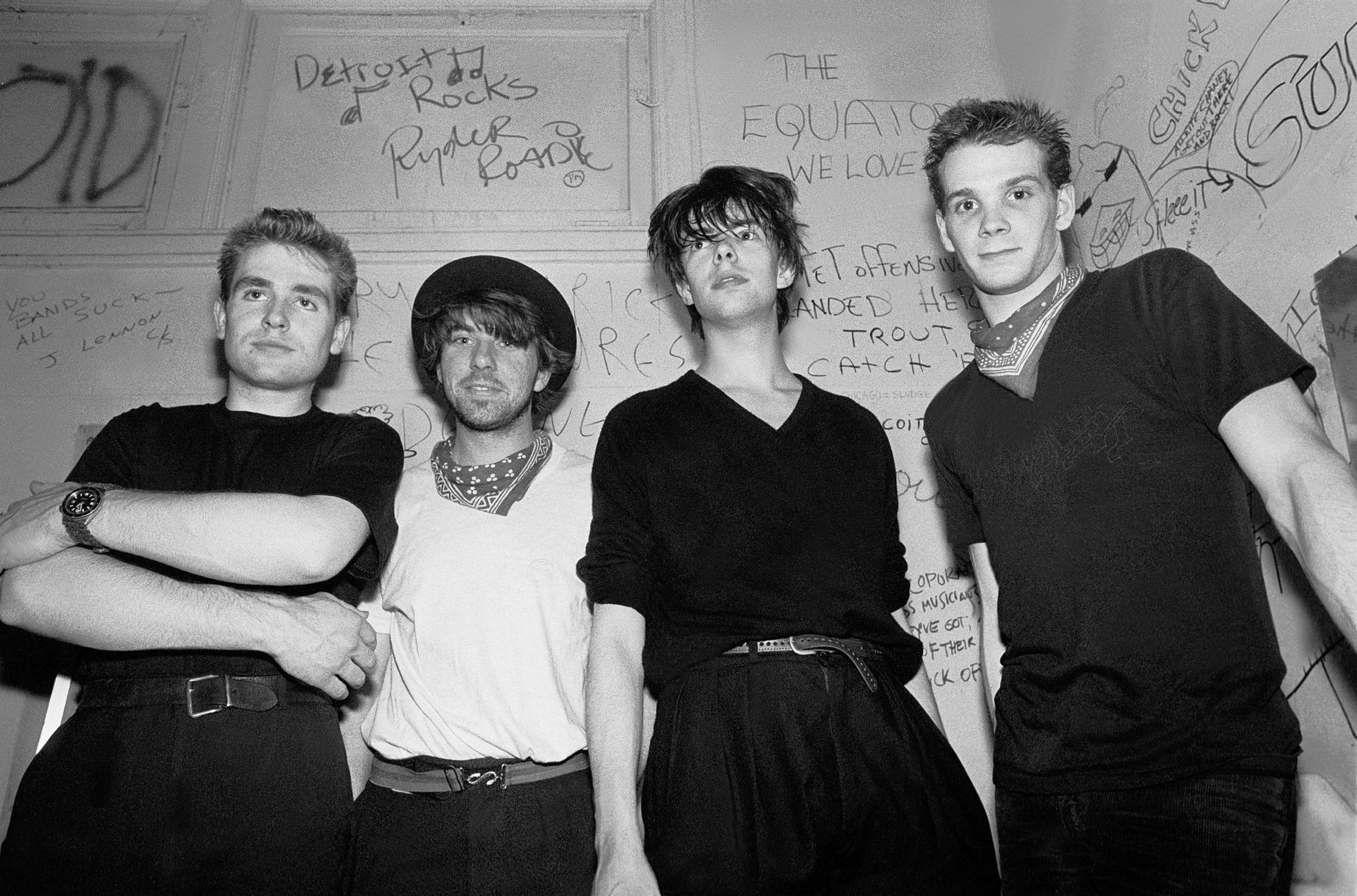Portrait of the music group Echo and the Bunnymen backstage at Tuts nightclub, Chicago, Illinois, April 11, 1981. Pictured...