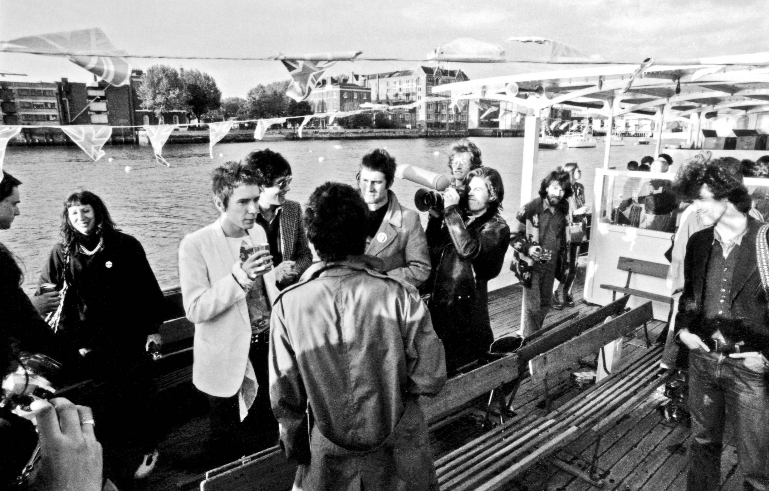 LONDON - JUNE 1977: English punk rock group the Sex Pistols aboard the Queen Elizabeth on the River Thames on June 7, 1977...