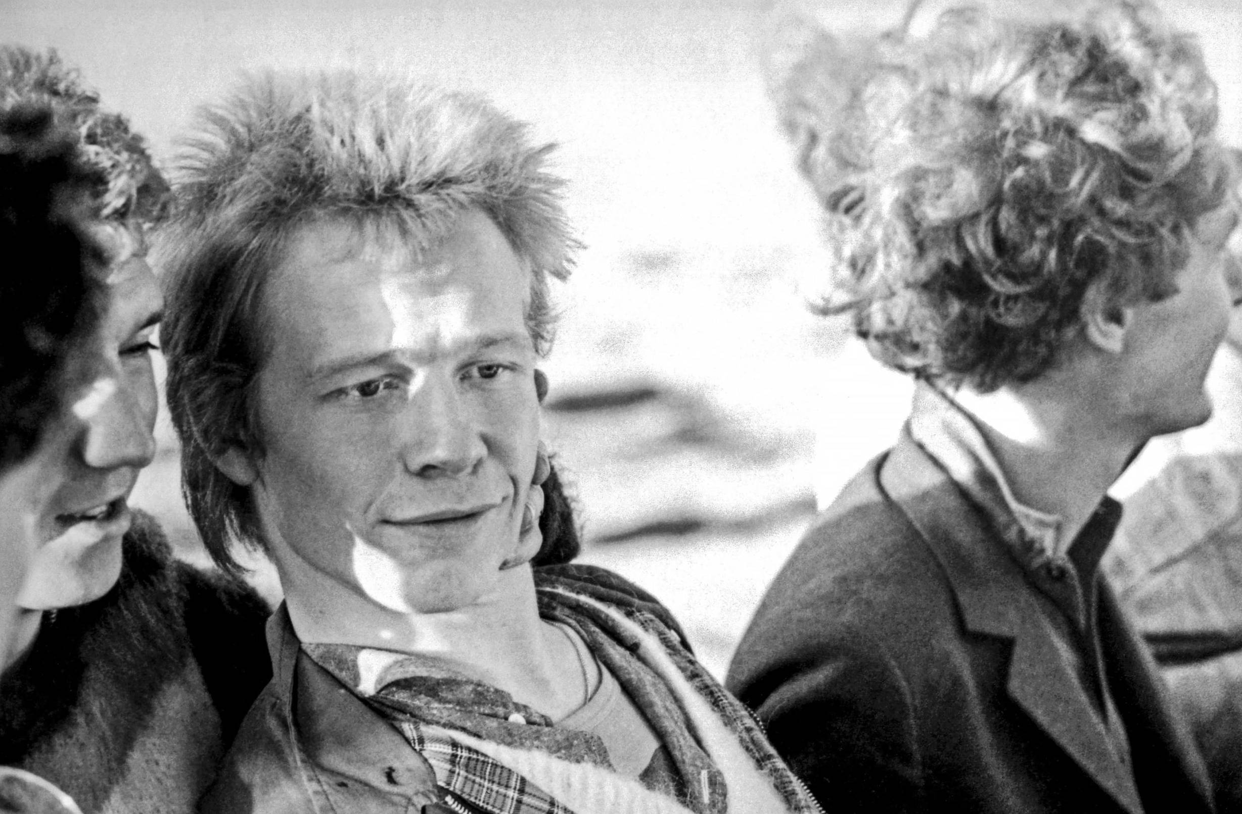 LONDON - JUNE 1977: Paul Cook of English punk rock band the Sex Pistols with manager Malcolm McLaren (right) and Steve Jon...