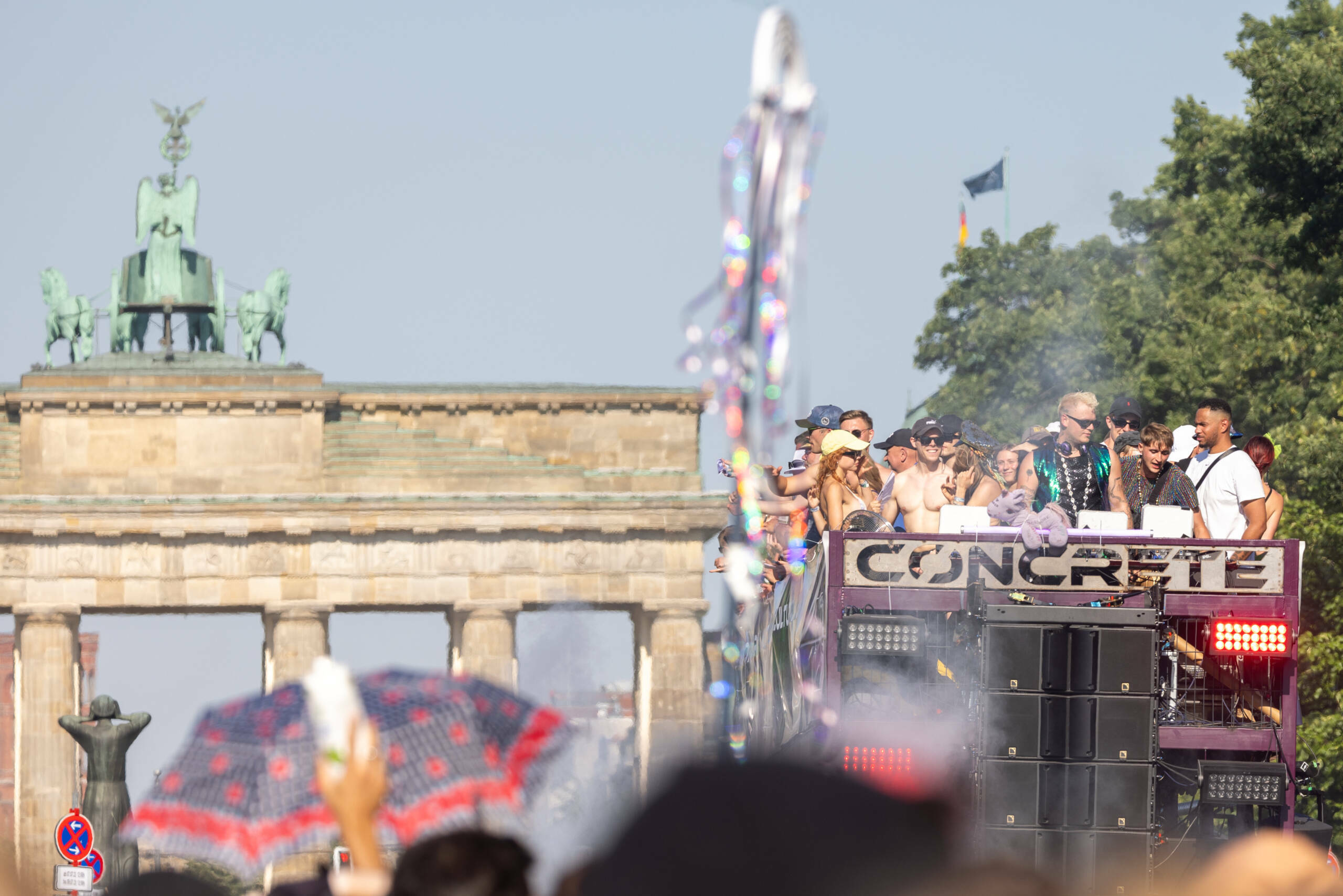 BERLIN, GERMANY - JULY 8: Techno music enthusiasts dance in front of the Brandenburg Gate during the Rave the Planet parad...