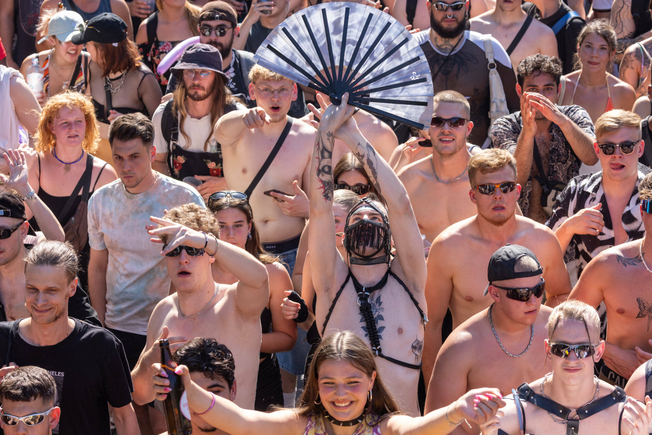 BERLIN, GERMANY - JULY 8: Techno music enthusiasts dance during the Rave the Planet parade in Tiergarten park on July 8, 2...