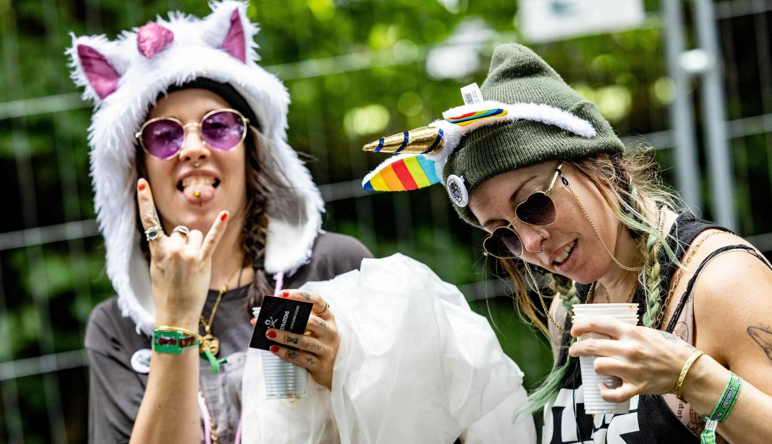 Visitors arrive for the Wacken Open Air music festival in Wacken, northern Germany on August 1, 2023, on the eve of the fe...