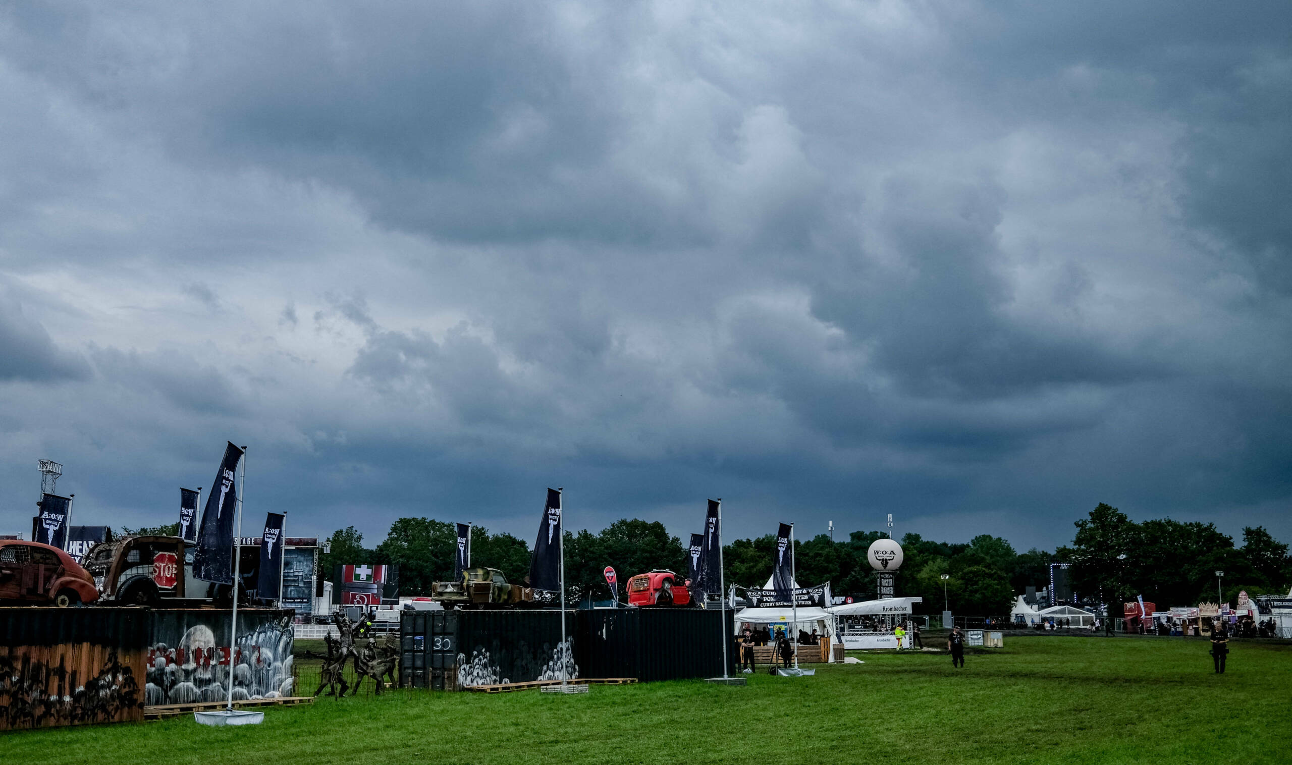 Dark clouds hang over the grounds of the Wacken Open Air music festival on August 2, 2023 in Wacken, northern Germany. The...