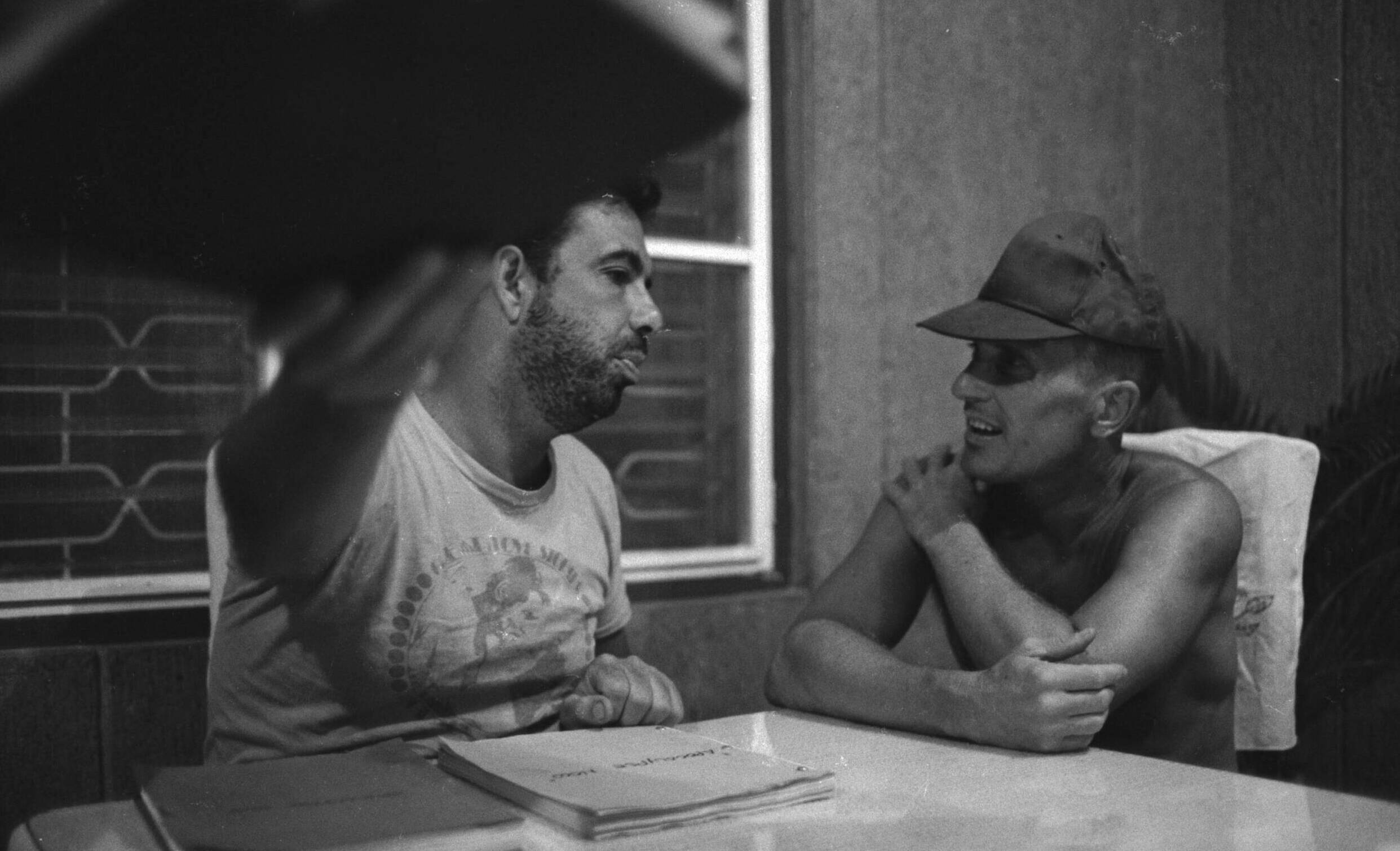 025412 19: Director Francis Ford Coppola goes over a script with actor Robert Duvall during rehearsals for his Vietnam War...